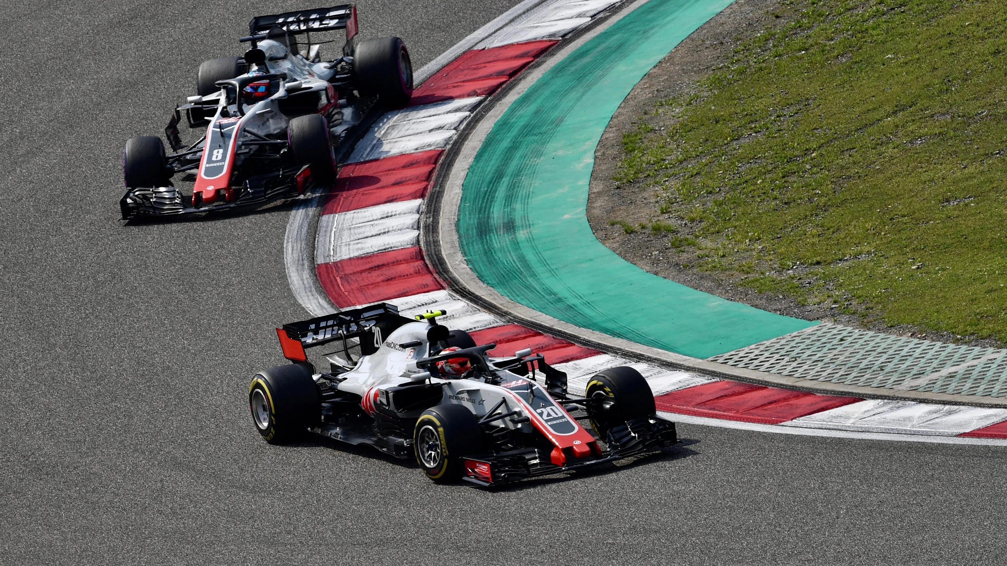 Kevin Magnussen (DEN) Haas VF-18 and Romain Grosjean (FRA) Haas VF-18 at Formula One World