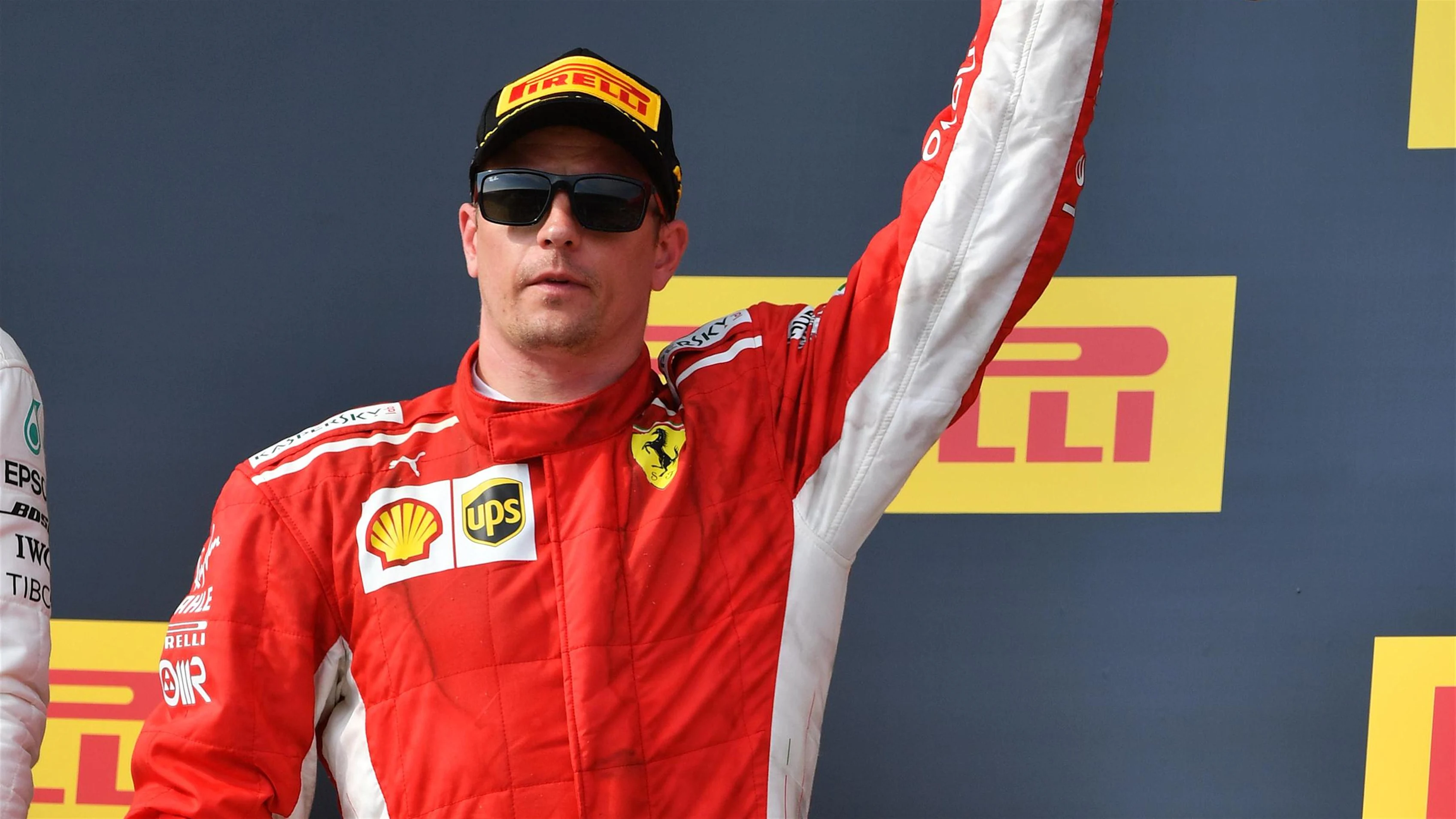 Kimi Raikkonen (FIN) Ferrari celebrates on the podium with the trophy at Formula One World