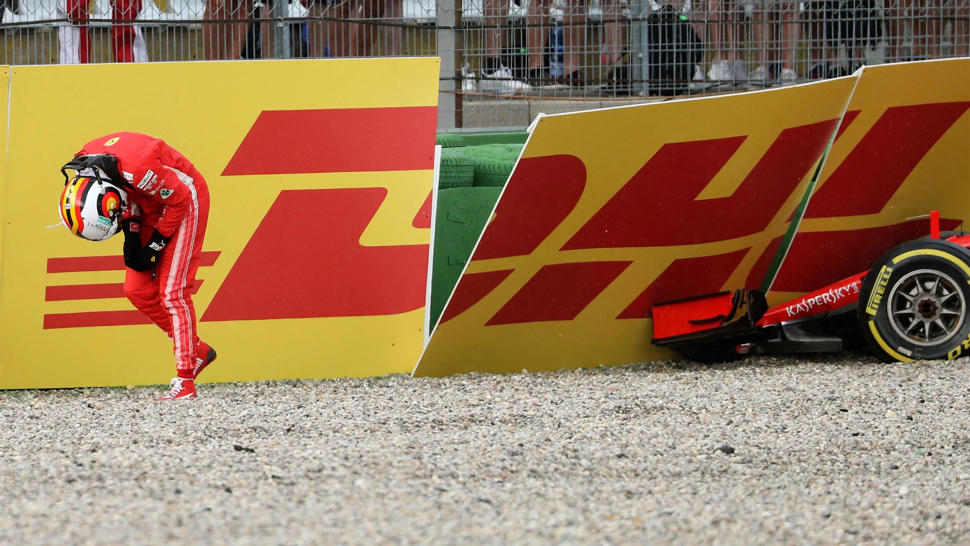 Sebastian Vettel (GER) Ferrari SF-71H walks in after crashing out of the race at Formula One World