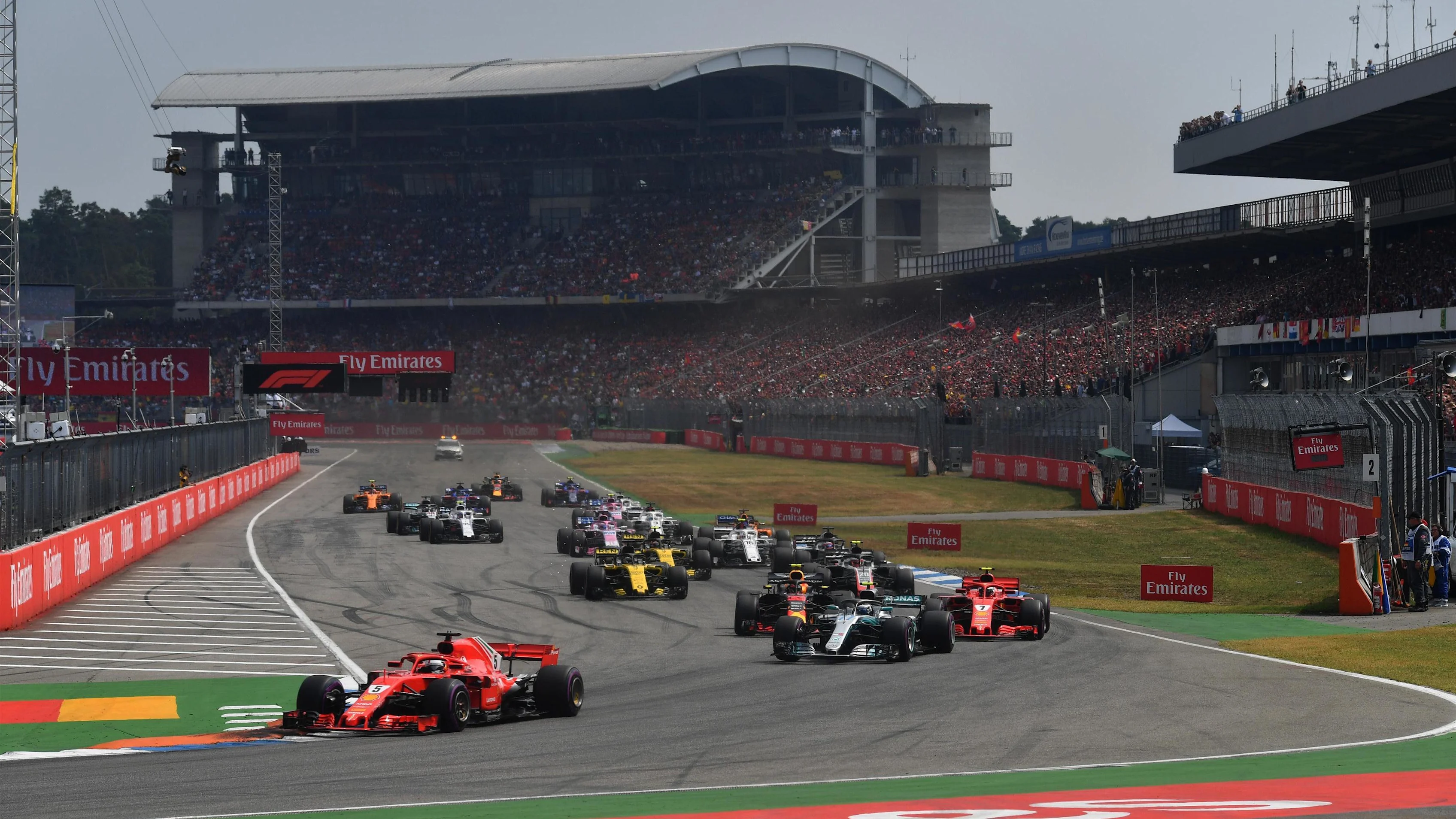 Sebastian Vettel (GER) Ferrari SF-71H leads at the start of the race at Formula One World
