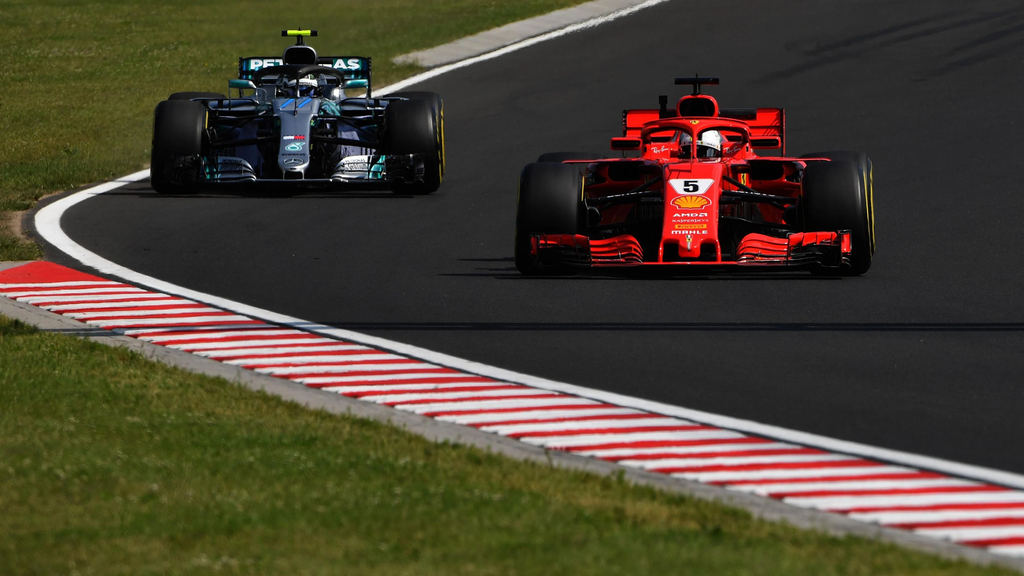 Sebastian Vettel (GER) Ferrari SF-71H and Valtteri Bottas (FIN) Mercedes-AMG F1 W09 EQ Power+ at