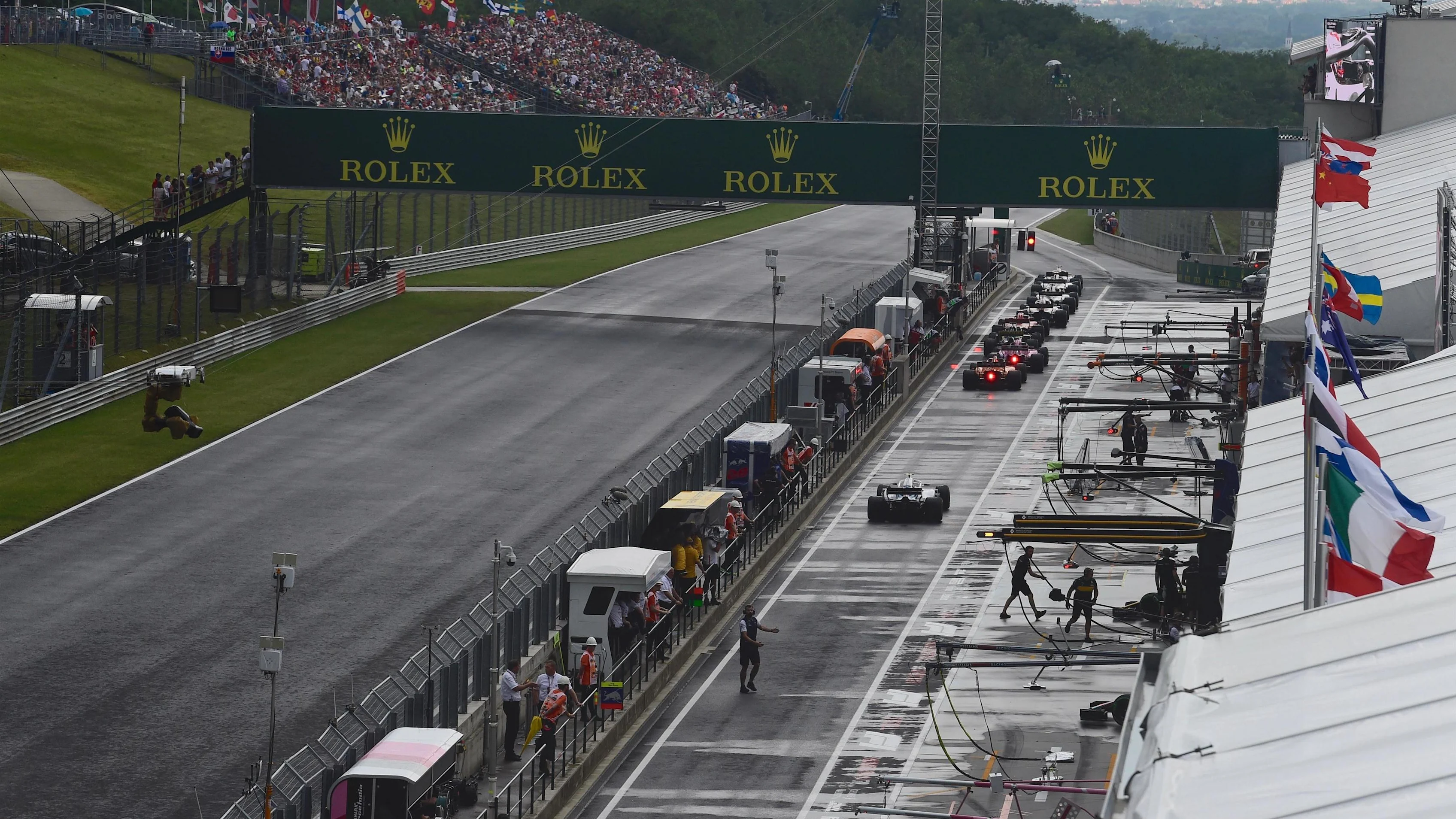 Cars queue in pit lane at Formula One World Championship, Rd12, Hungarian Grand Prix, Qualifying,