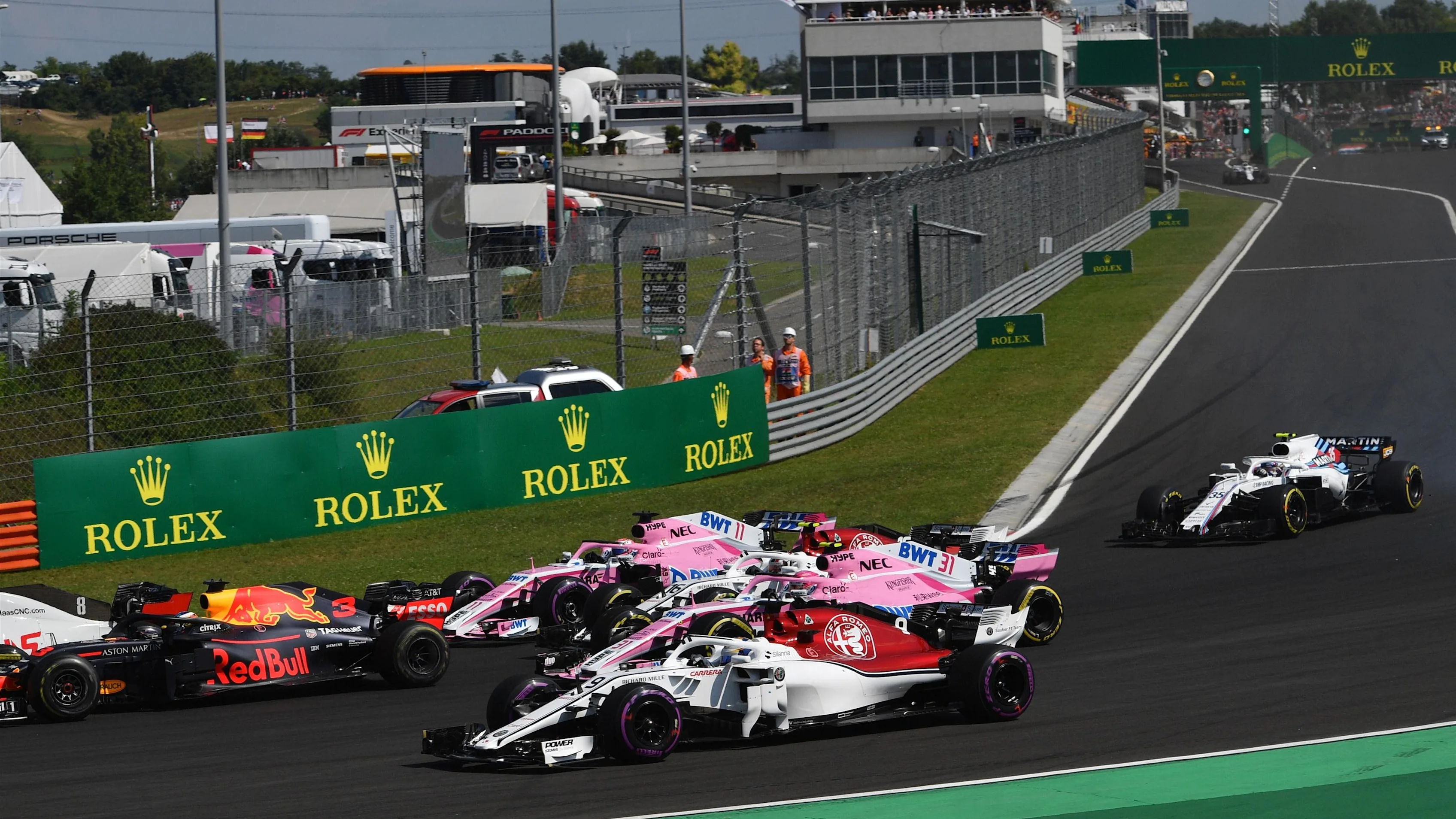 Marcus Ericsson (SWE) Alfa Romeo Sauber C37 and Esteban Ocon (FRA) Force India VJM11 at the start of the race at Formula One World Championship, Rd12, Hungarian Grand Prix, Race, Hungaroring, Hungary, Sunday 29 July 2018. © Jerry Andre/Sutton Images