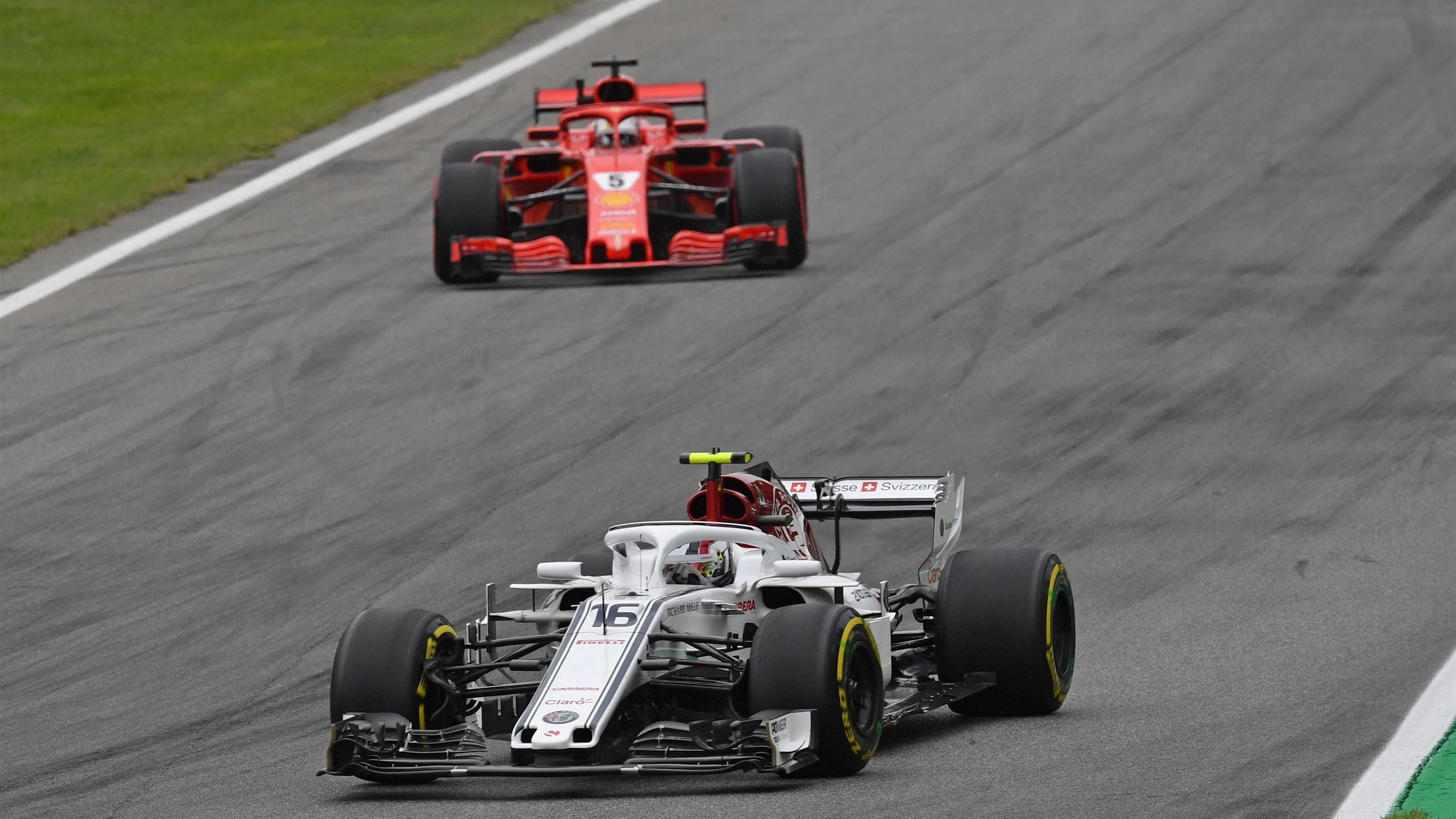 Charles Leclerc, Alfa Romeo Sauber C37 and Sebastian Vettel, Ferrari SF71H at Formula One World