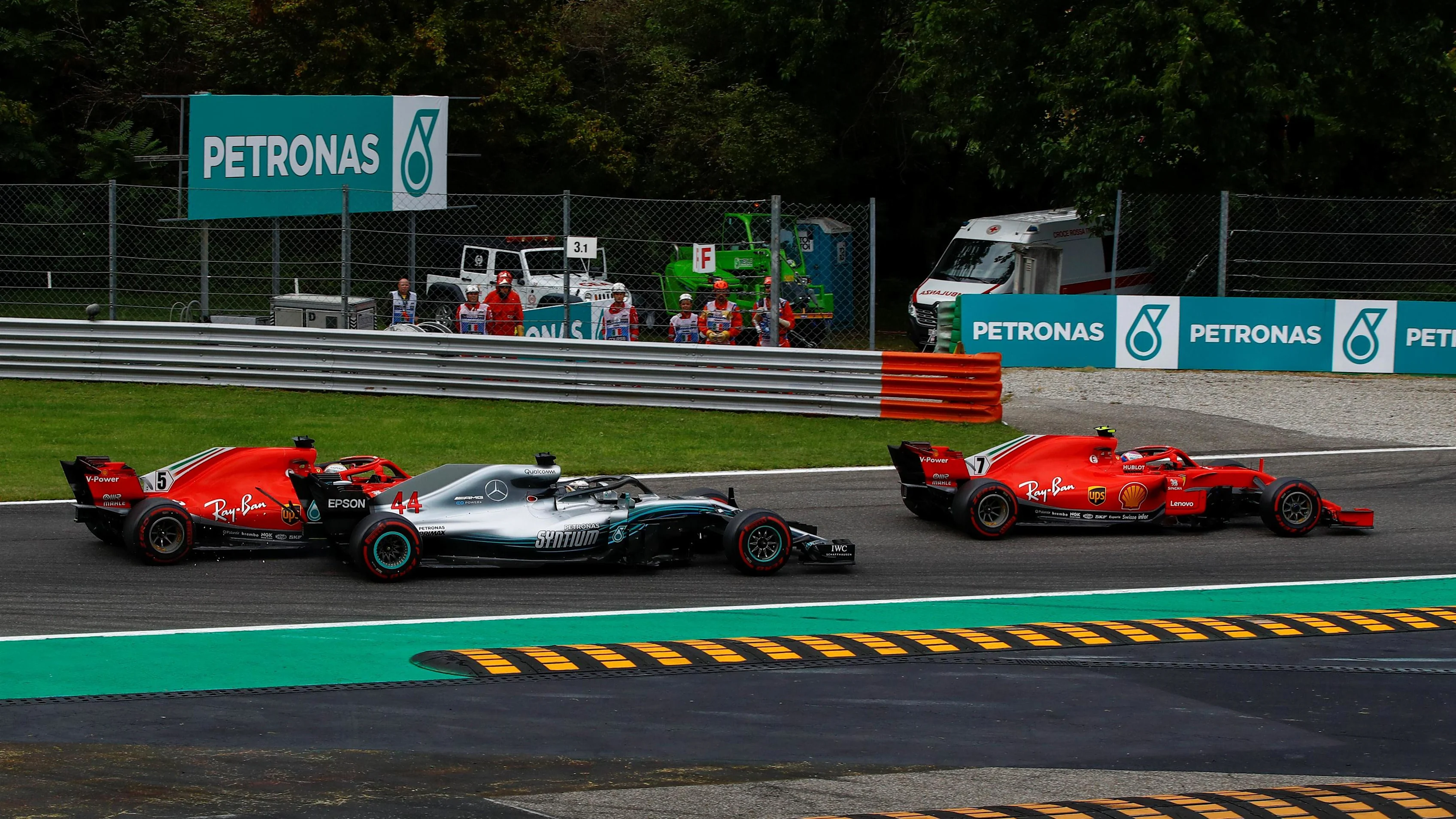 Kimi Raikkonen, Ferrari SF71H leads and Sebastian Vettel, Ferrari SF71H and Lewis Hamilton,