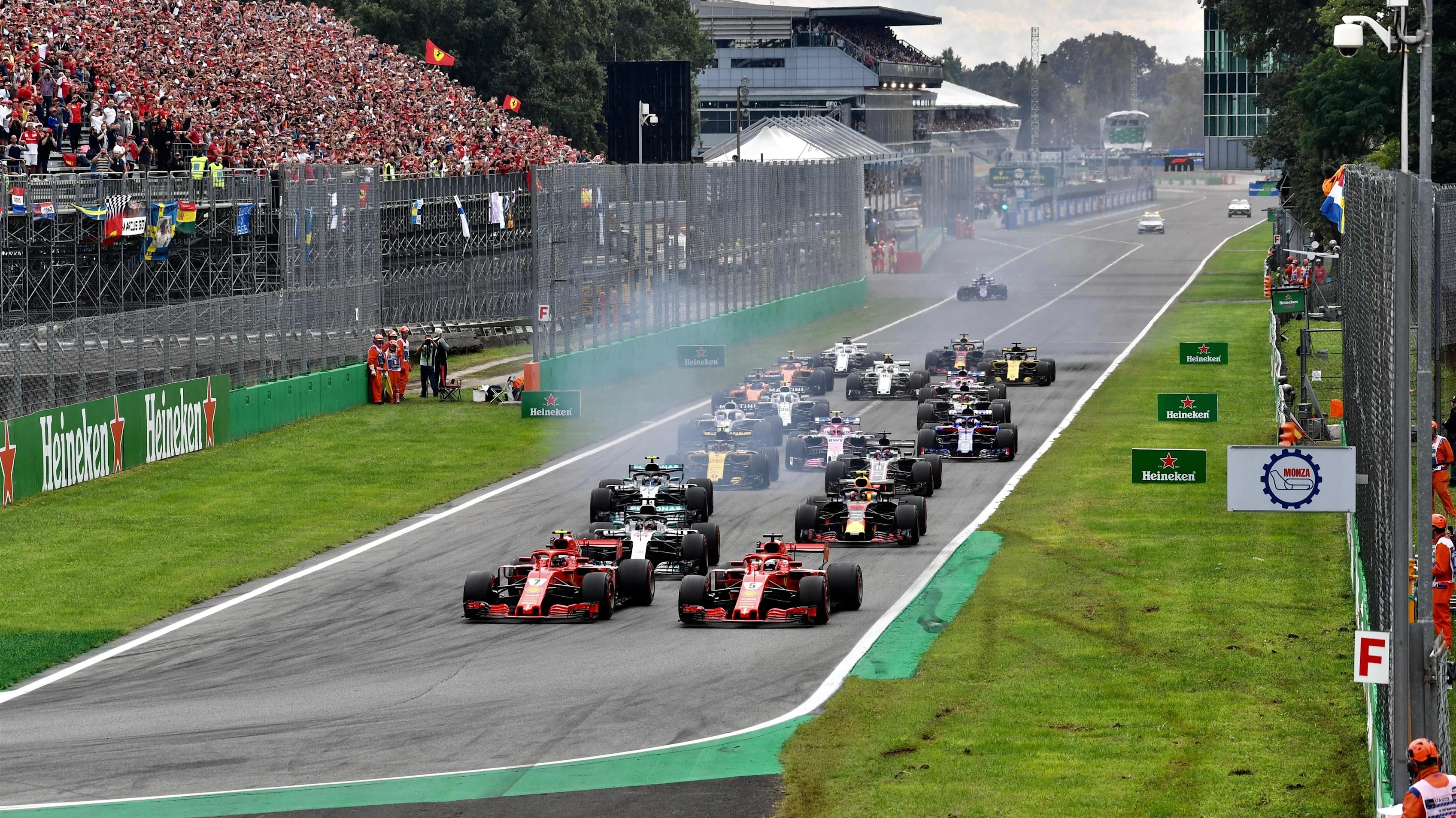 Sebastian Vettel, Ferrari SF71H and Kimi Raikkonen, Ferrari SF71H lead at the start of the race at
