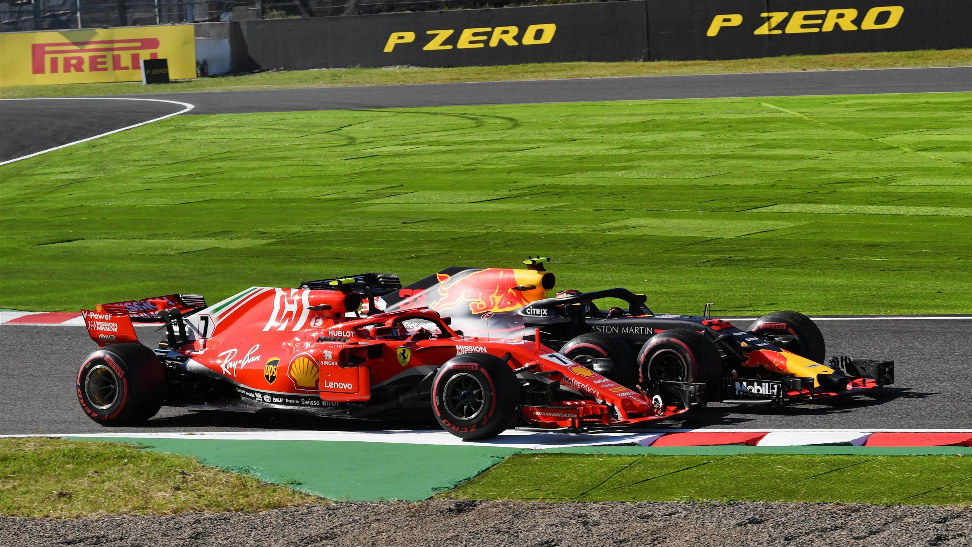 Kimi Raikkonen, Ferrari SF71H and Max Verstappen, Red Bull Racing RB14 battle at Formula One World Championship, Rd17, Japanese Grand Prix, Race, Suzuka, Japan, Sunday 7 October 2018.