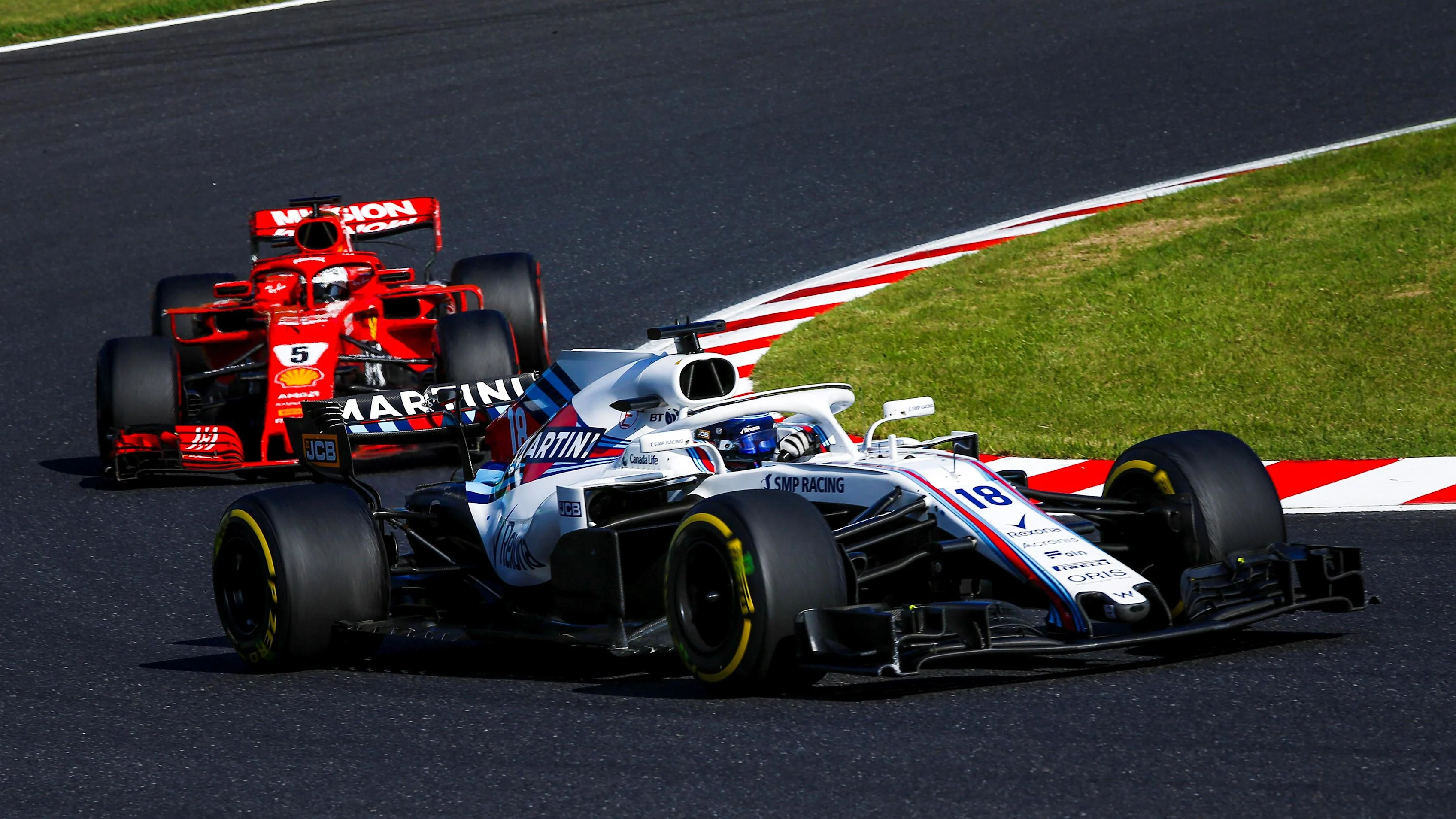 Lance Stroll, Williams FW41 and Sebastian Vettel, Ferrari SF71H at Formula One World Championship,