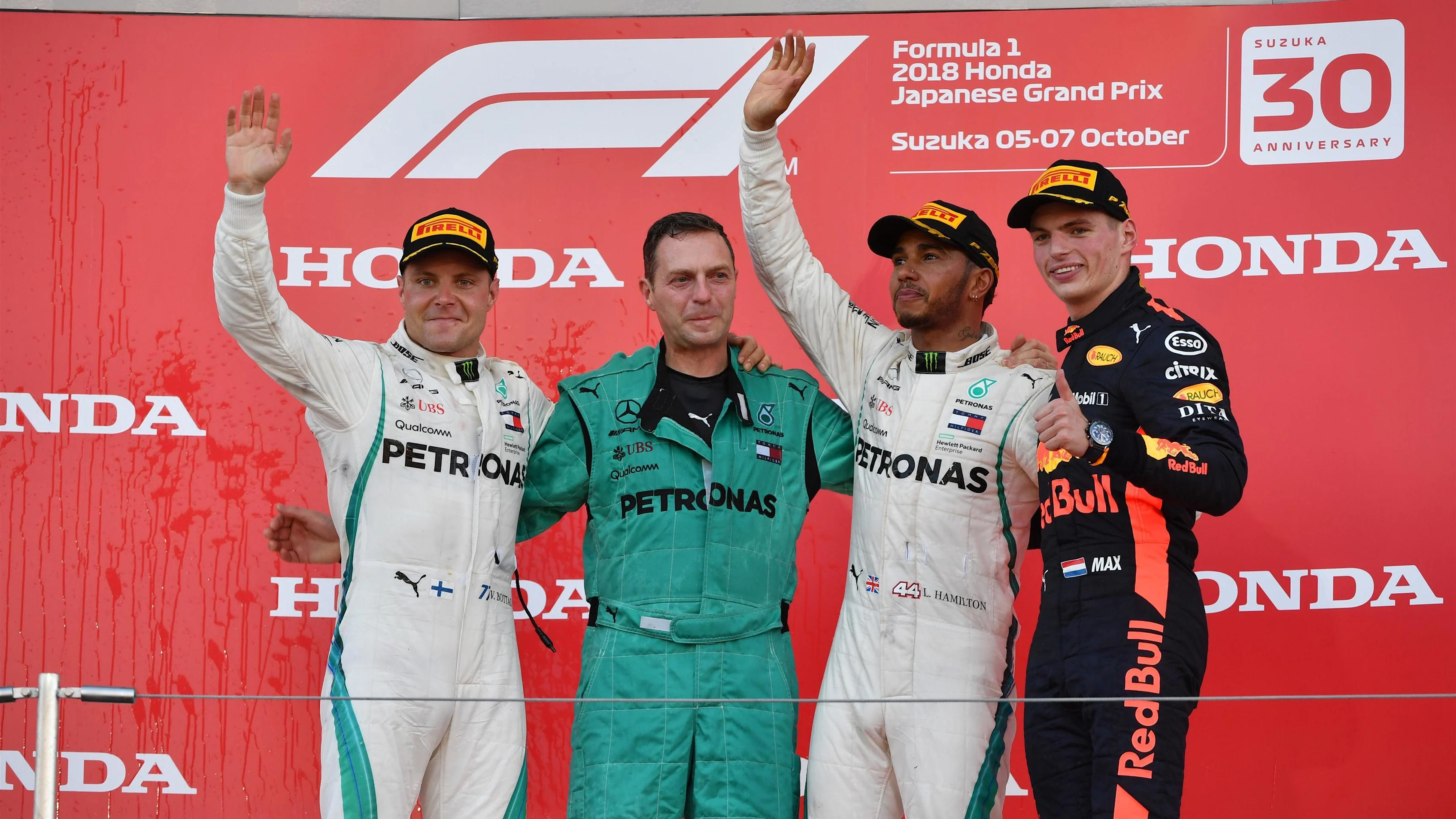 (L to R): Valtteri Bottas, Mercedes AMG F1, Matt Deane, Mercedes AMG F1 Chief Mechanic, Lewis Hamilton, Mercedes AMG F1 and Max Verstappen, Red Bull Racing celebrate on the podium at Formula One World Championship, Rd17, Japanese Grand Prix, Race, Suzuka, Japan, Sunday 7 October 2018.
