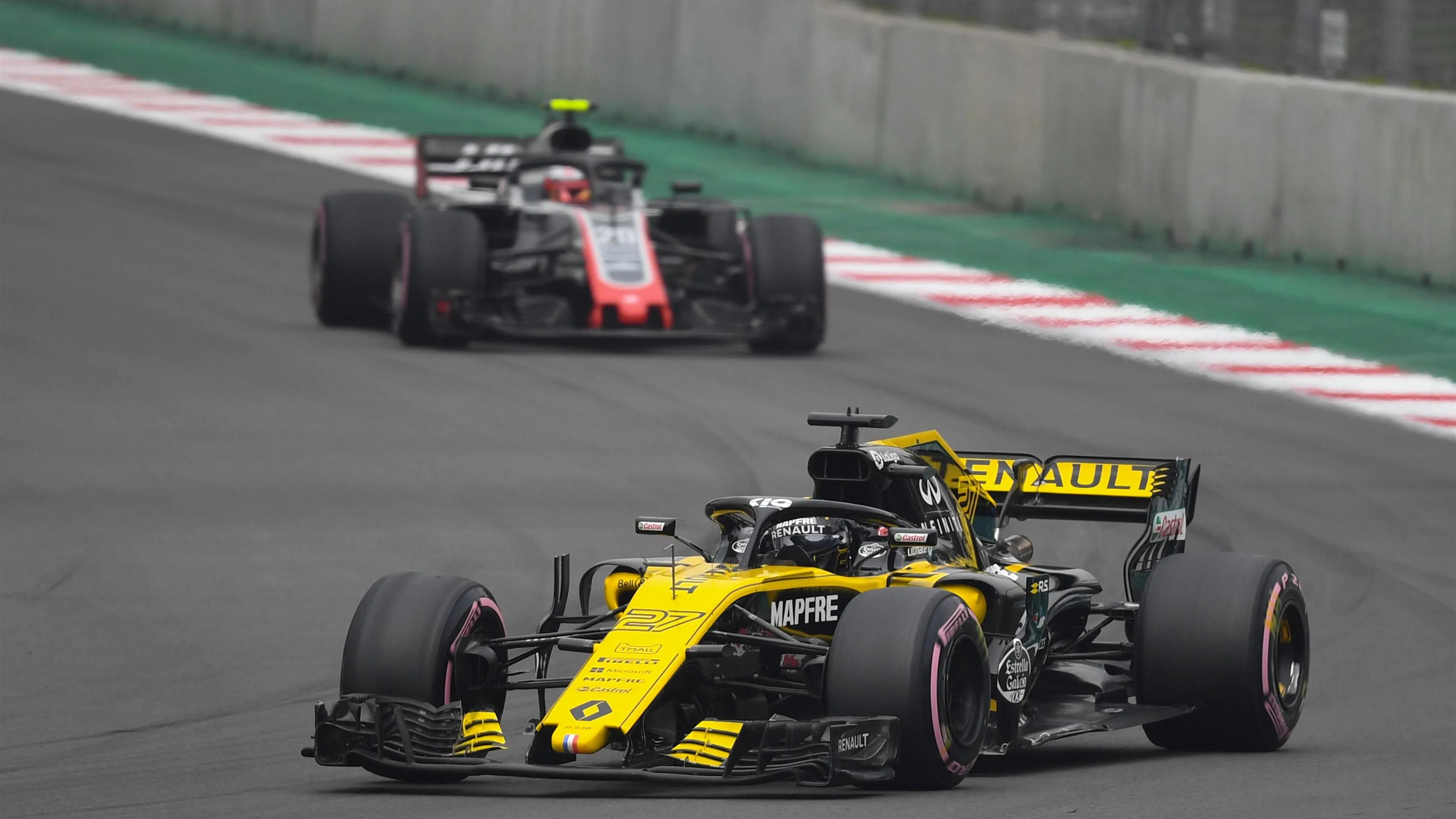 Nico Hulkenberg, Renault Sport F1 Team R.S. 18 and Kevin Magnussen, Haas F1 Team VF-18 at Formula