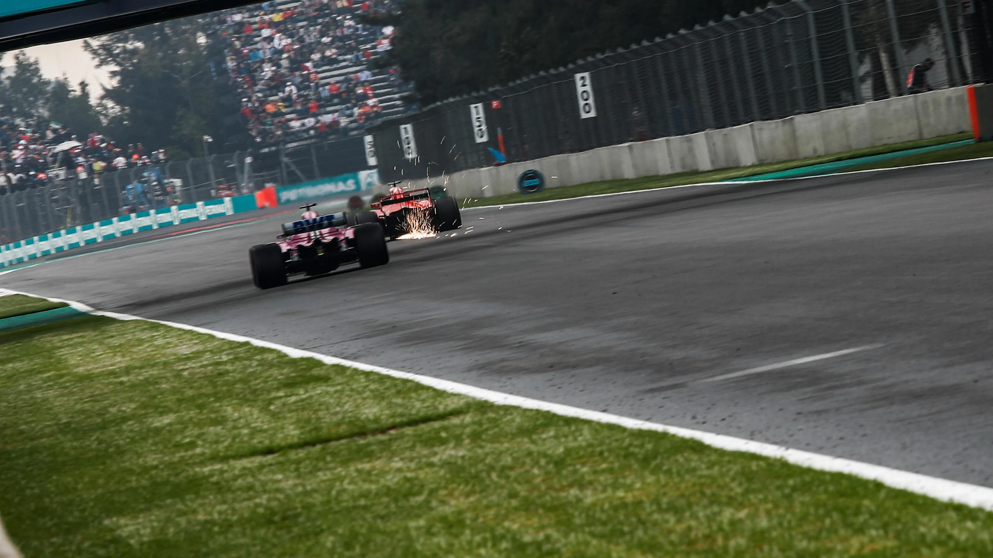 Sergio Perez, Racing Point Force India VJM11 and Sebastian Vettel, Ferrari SF71H at Formula One