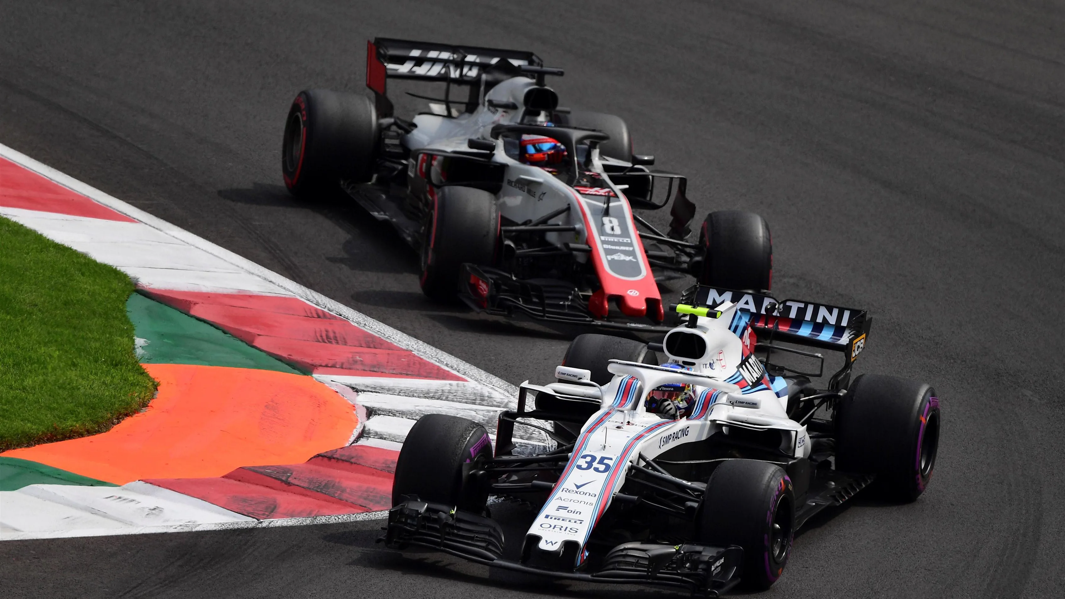Sergey Sirotkin, Williams FW41 and Romain Grosjean, Haas F1 Team VF-18 at Formula One World