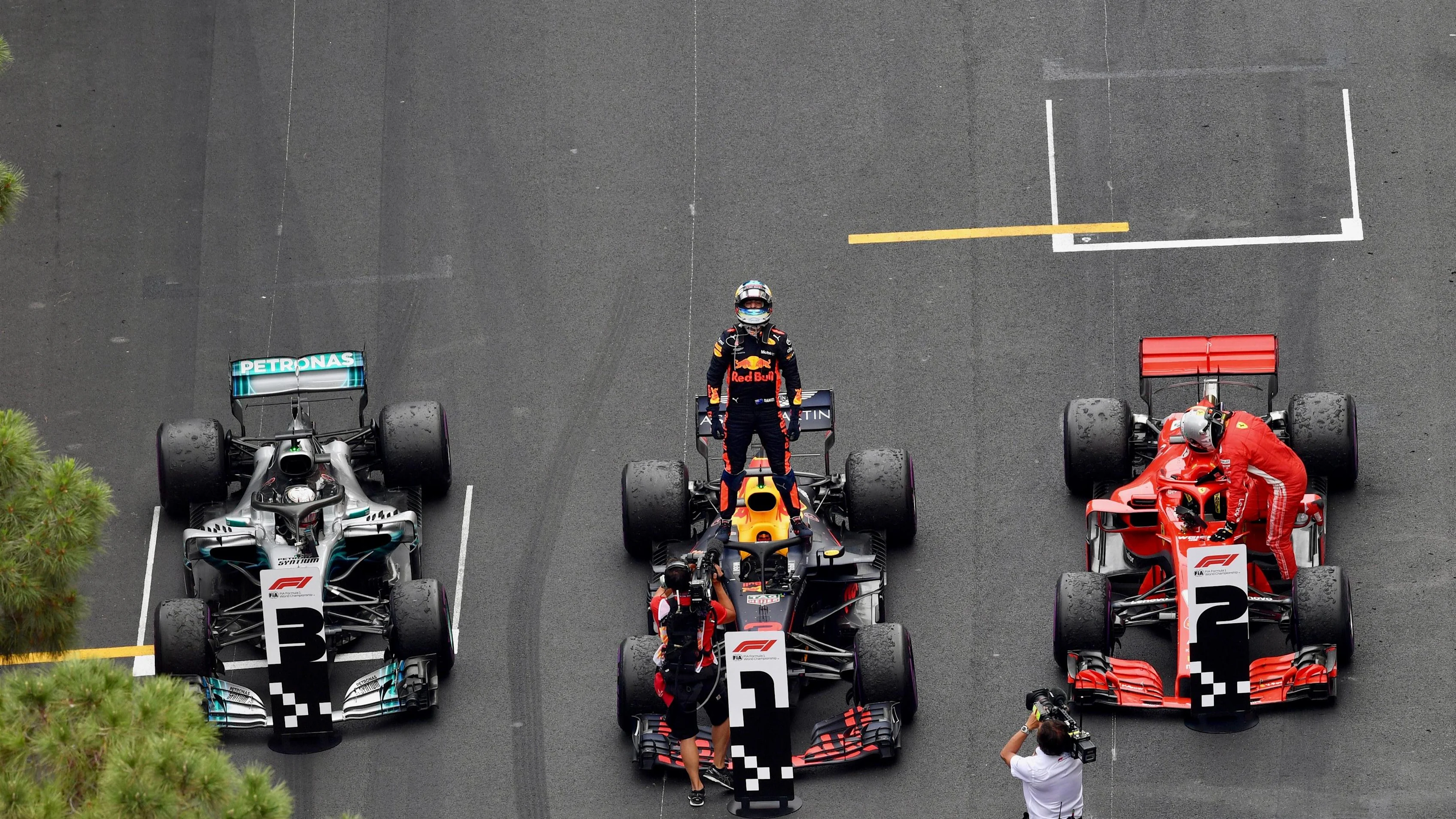 Daniel Ricciardo (AUS) Red Bull Racing RB14 celebrates in parc ferme alongside Sebastian Vettel (GER) Ferrari SF-71H and Lewis Hamilton (GBR) Mercedes-AMG F1 W09 EQ Power+ at Formula One World Championship, Rd6, Monaco Grand Prix, Race, Monte-Carlo, Monac