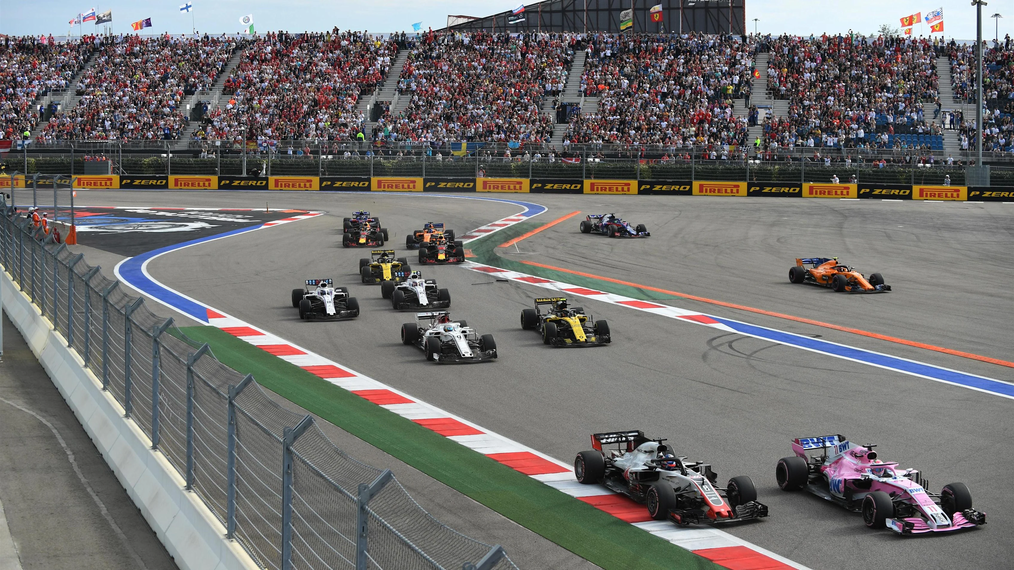 Sergio Perez, Racing Point Force India VJM11, Romain Grosjean, Haas F1 Team VF-18 and Marcus