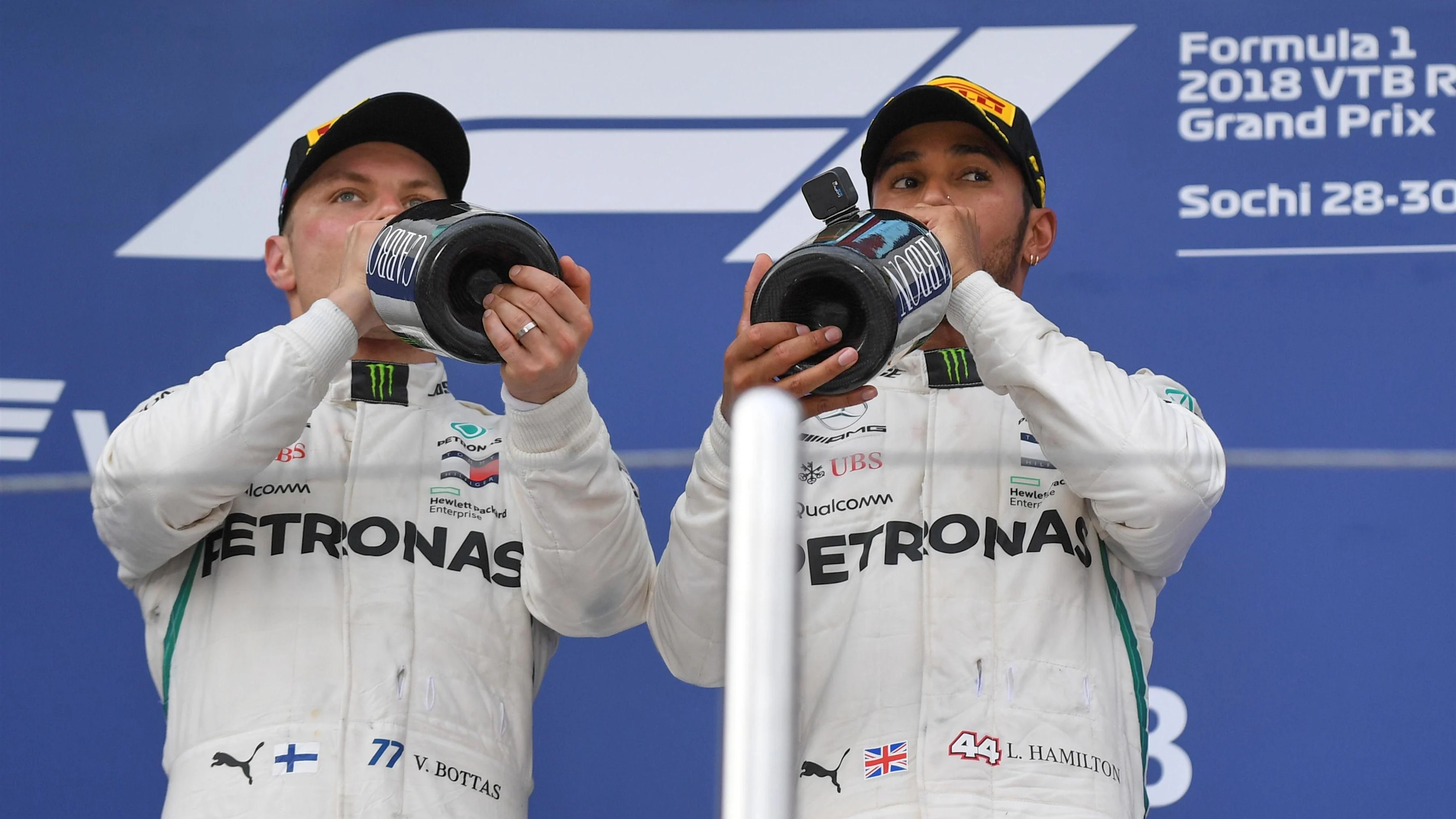 Valtteri Bottas, Mercedes AMG F1 and Lewis Hamilton, Mercedes AMG F1 with the champagne on the podium at Formula One World Championship, Rd16, Russian Grand Prix, Race, Sochi Autodrom, Sochi, Krasnodar Krai, Russia, Sunday 30 September 2018.