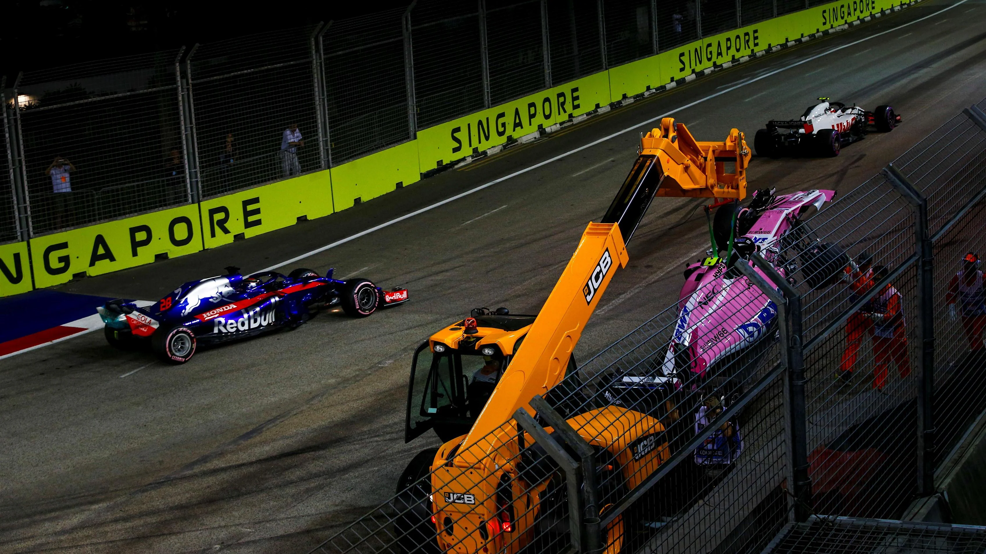 Brendon Hartley, Scuderia Toro Rosso STR13 passes the crashed car of Esteban Ocon, Racing Point