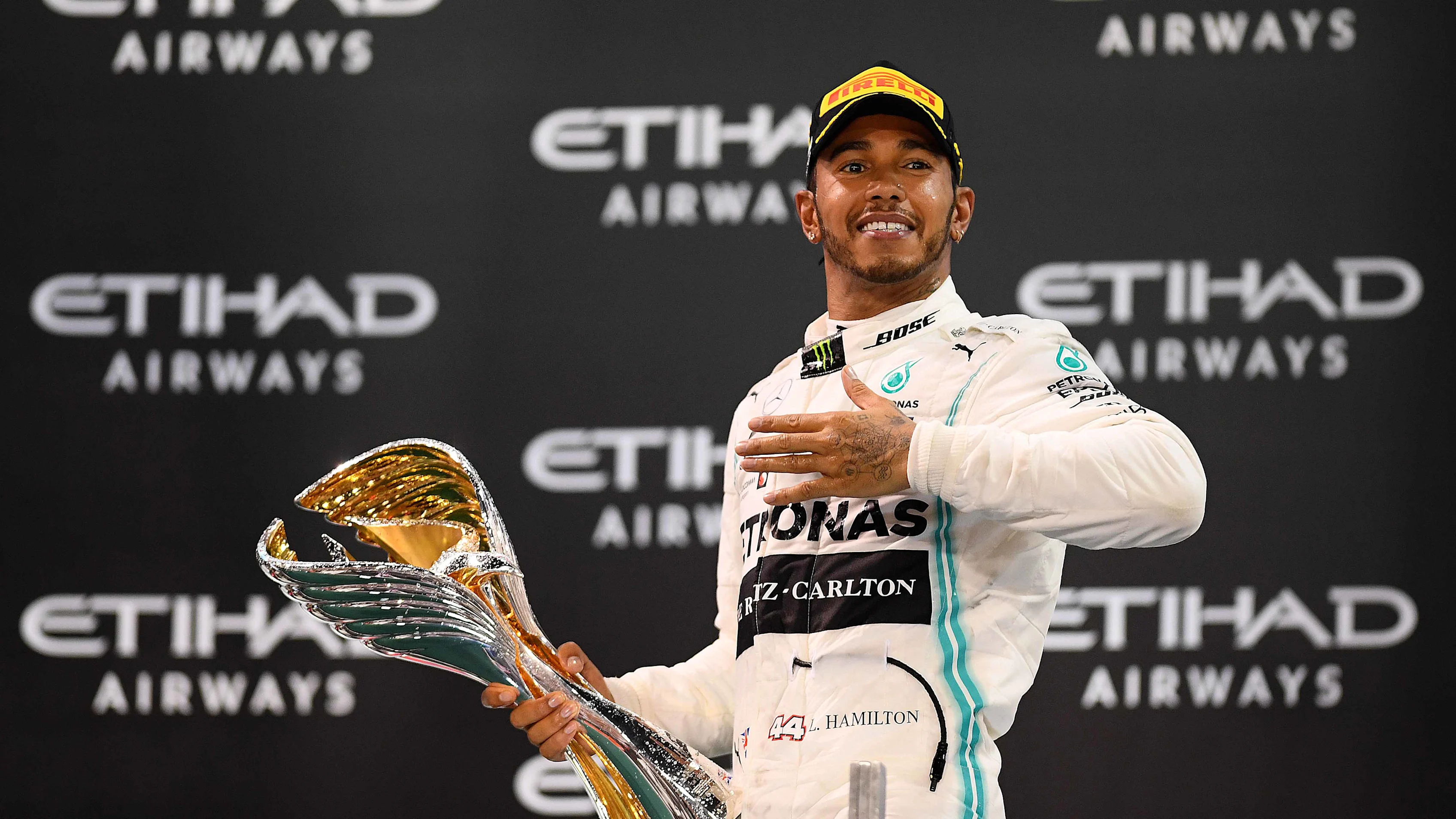 ABU DHABI, UNITED ARAB EMIRATES - DECEMBER 01: Race winner Lewis Hamilton of Great Britain and