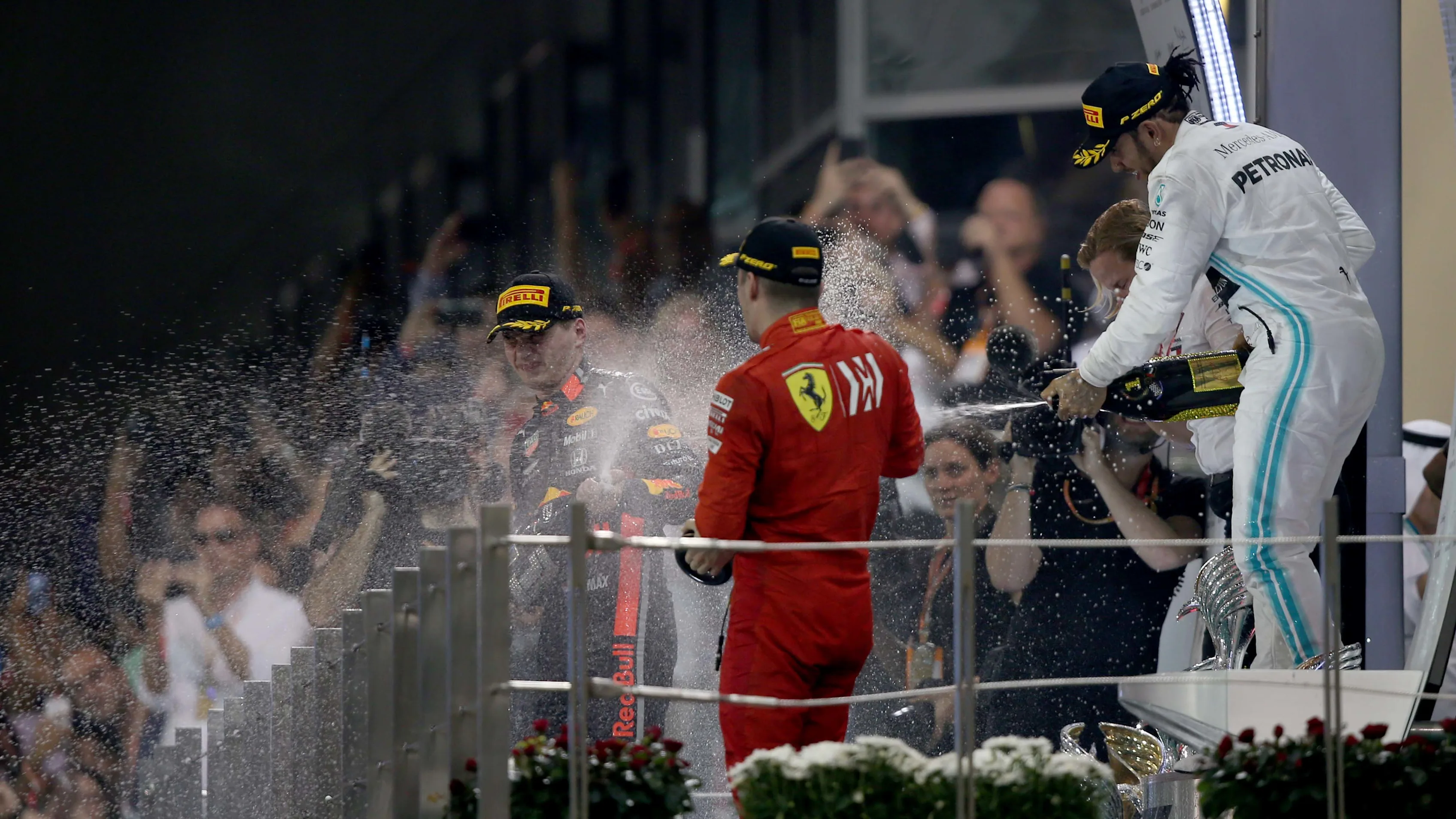 ABU DHABI, UNITED ARAB EMIRATES - DECEMBER 01: Top three finishers Lewis Hamilton of Great Britain