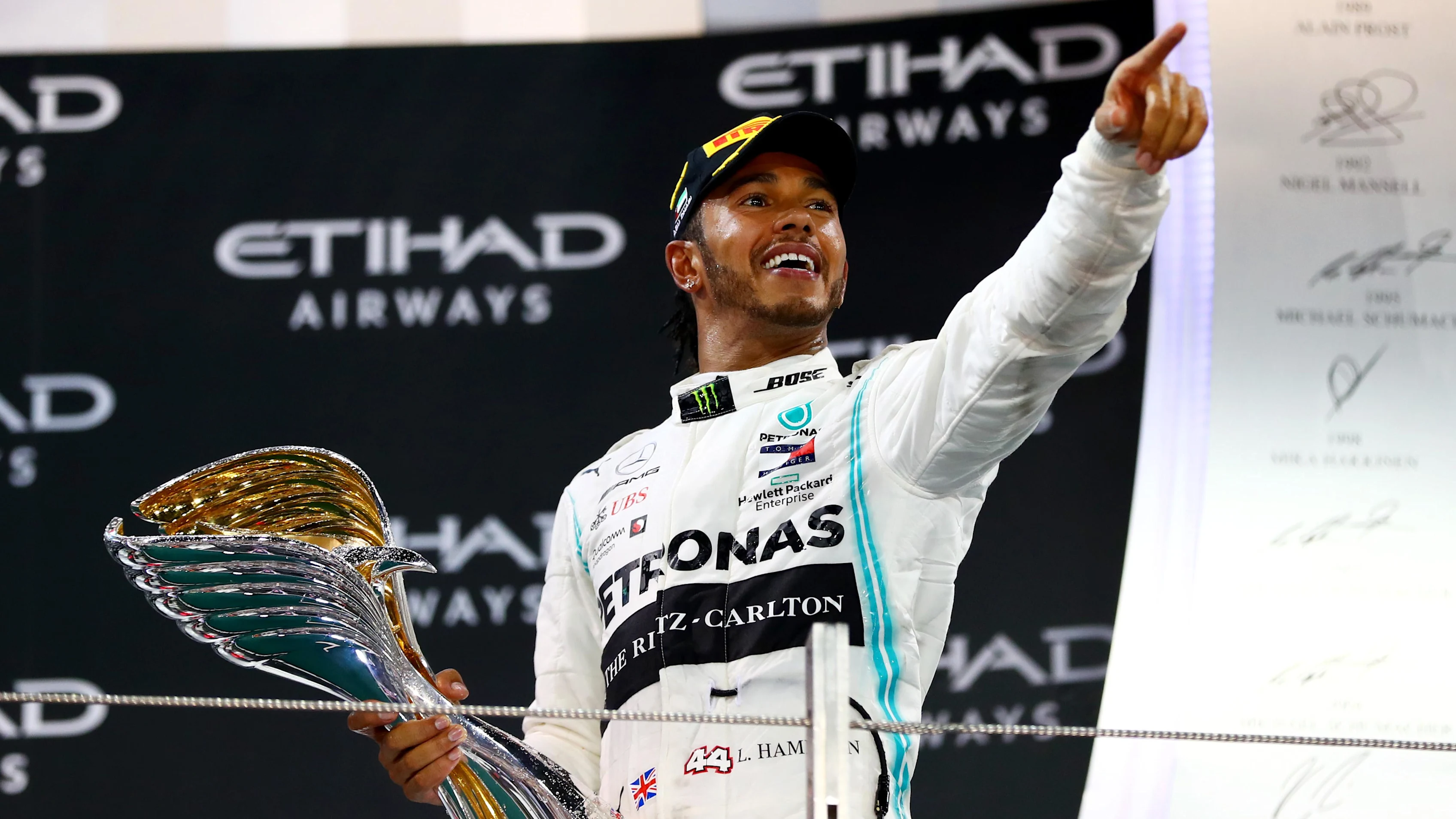 ABU DHABI, UNITED ARAB EMIRATES - DECEMBER 01: Race winner Lewis Hamilton of Great Britain and