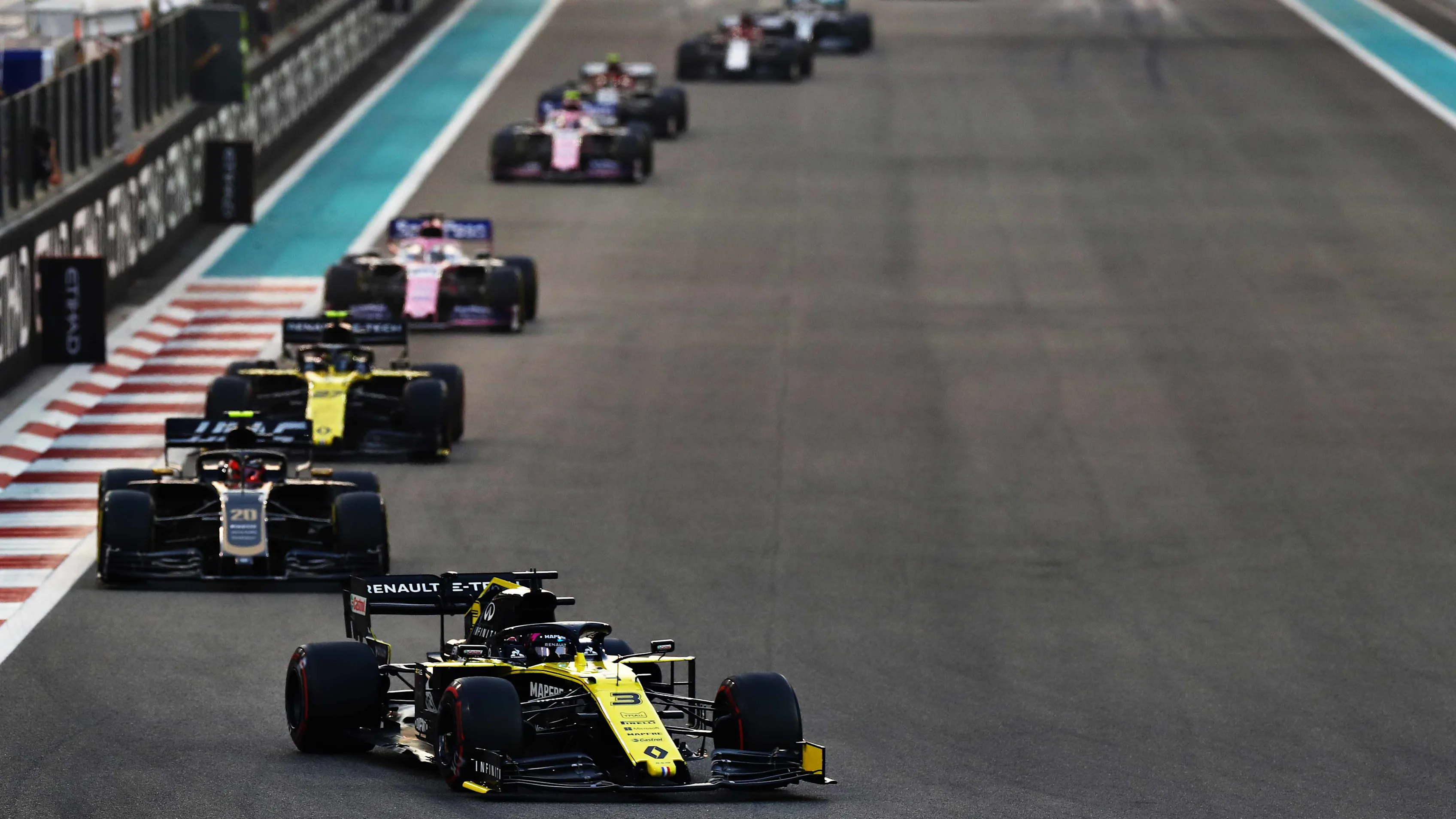 ABU DHABI, UNITED ARAB EMIRATES - DECEMBER 01: Daniel Ricciardo of Australia driving the (3) Renault Sport Formula One Team RS19 leads Kevin Magnussen of Denmark driving the (20) Haas F1 Team VF-19 Ferrari on track during the F1 Grand Prix of Abu Dhabi at Yas Marina Circuit on December 01, 2019 in Abu Dhabi, United Arab Emirates. (Photo by Mark Thompson/Getty Images)