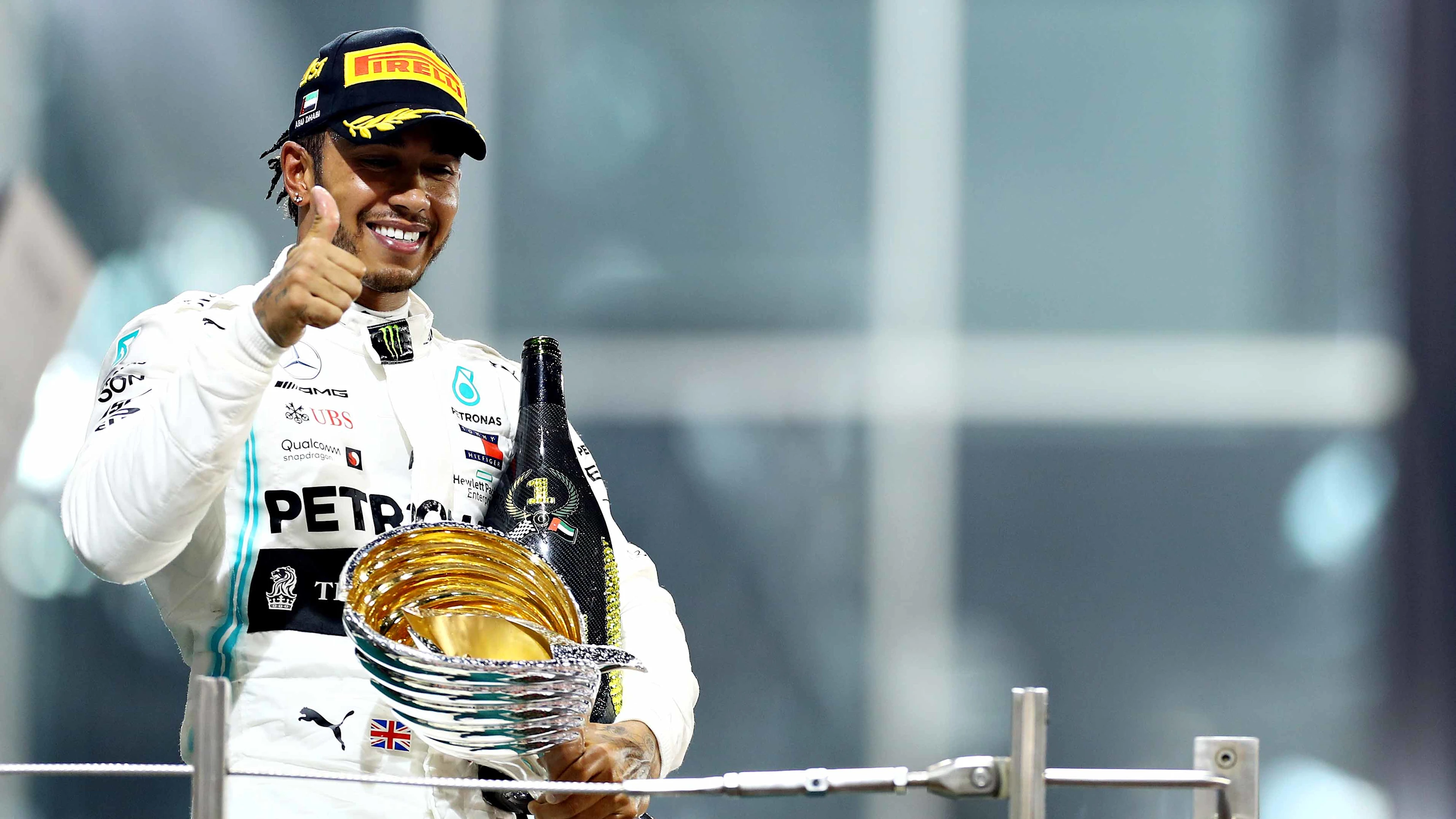 ABU DHABI, UNITED ARAB EMIRATES - DECEMBER 01: Race winner Lewis Hamilton of Great Britain and Mercedes GP celebrates on the podium during the F1 Grand Prix of Abu Dhabi at Yas Marina Circuit on December 01, 2019 in Abu Dhabi, United Arab Emirates. (Photo by Mark Thompson/Getty Images)