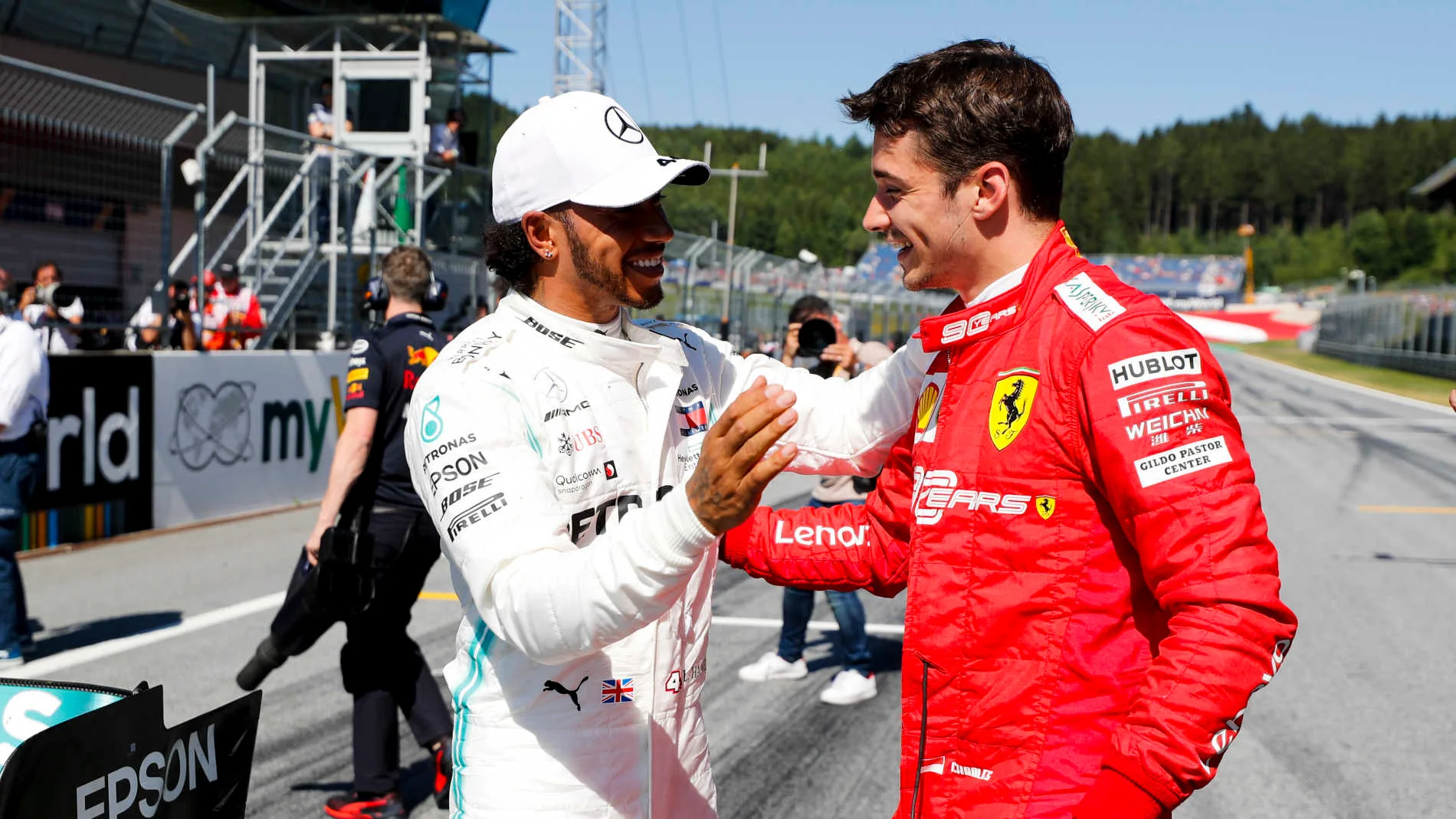 RED BULL RING, AUSTRIA - JUNE 29: Lewis Hamilton, Mercedes AMG F1 and Pole Sitter Charles Leclerc, Ferrari celebrate in Parc Ferme during the Austrian GP at Red Bull Ring on June 29, 2019 in Red Bull Ring, Austria. (Photo by Steven Tee / LAT Images)