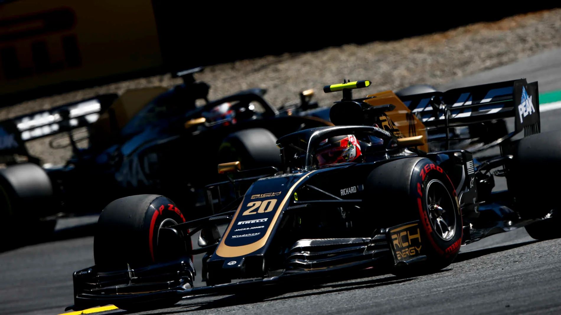 RED BULL RING, AUSTRIA - JUNE 30: Kevin Magnussen, Haas VF-19, leads Romain Grosjean, Haas VF-19