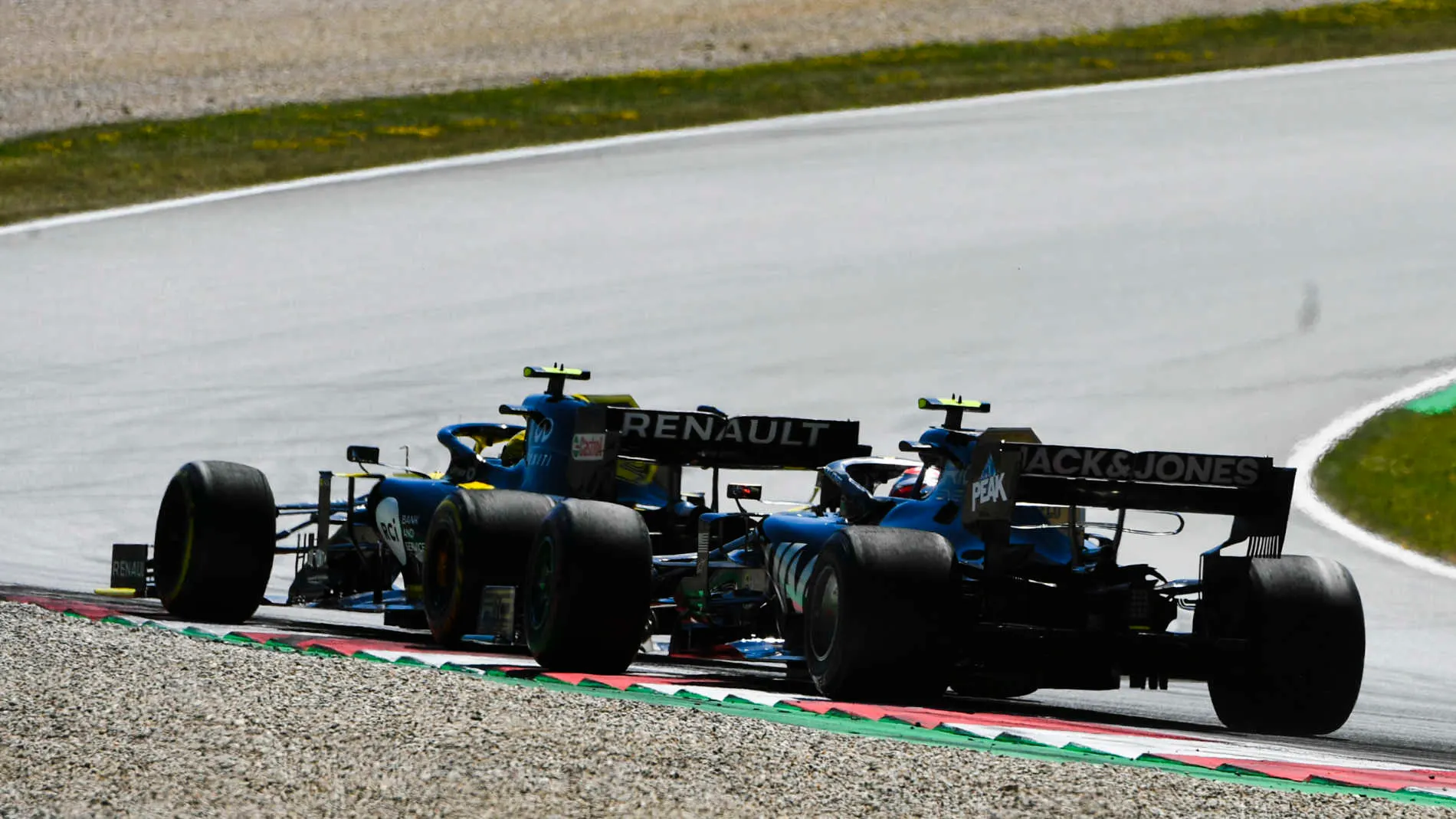 RED BULL RING, AUSTRIA - JUNE 30: Kevin Magnussen, Haas VF-19, battles with Nico Hulkenberg, Renault R.S. 19 during the Austrian GP at Red Bull Ring on June 30, 2019 in Red Bull Ring, Austria. (Photo by Mark Sutton / Sutton Images)