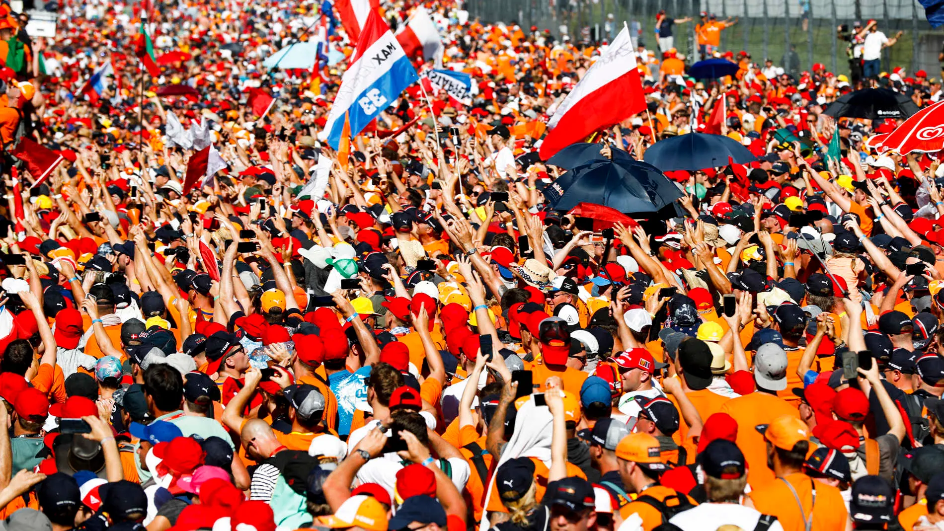 RED BULL RING, AUSTRIA - JUNE 30: Dutch Max Verstappen fans storm the track to celebrate the