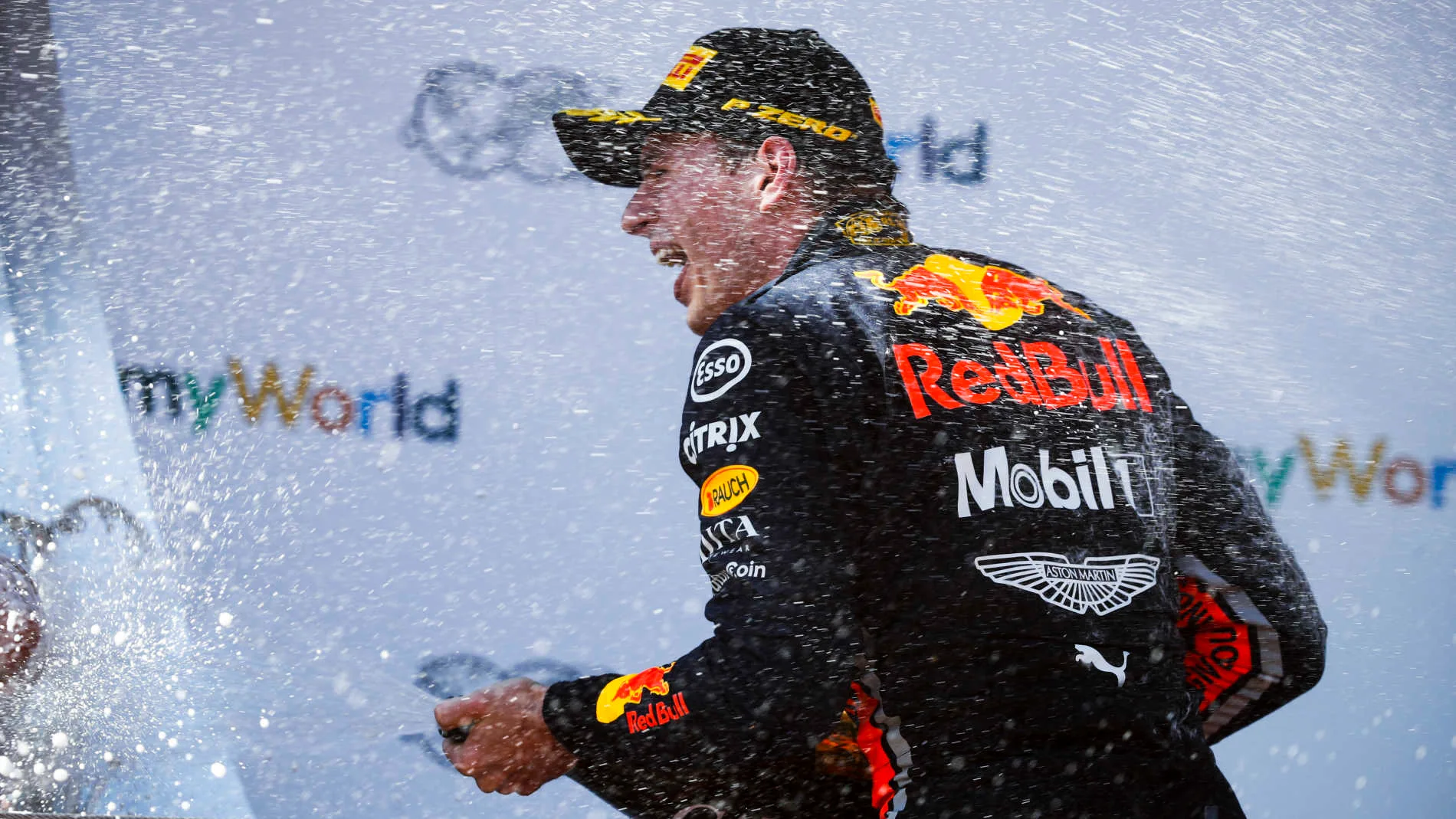 RED BULL RING, AUSTRIA - JUNE 30: Max Verstappen, Red Bull Racing, 1st position, sprays Champagne on the podium during the Austrian GP at Red Bull Ring on June 30, 2019 in Red Bull Ring, Austria. (Photo by Glenn Dunbar / LAT Images)