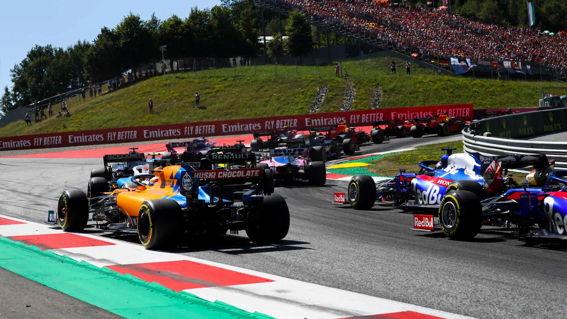 RED BULL RING, AUSTRIA - JUNE 30: Lance Stroll, Racing Point RP19, leads Carlos Sainz Jr., McLaren