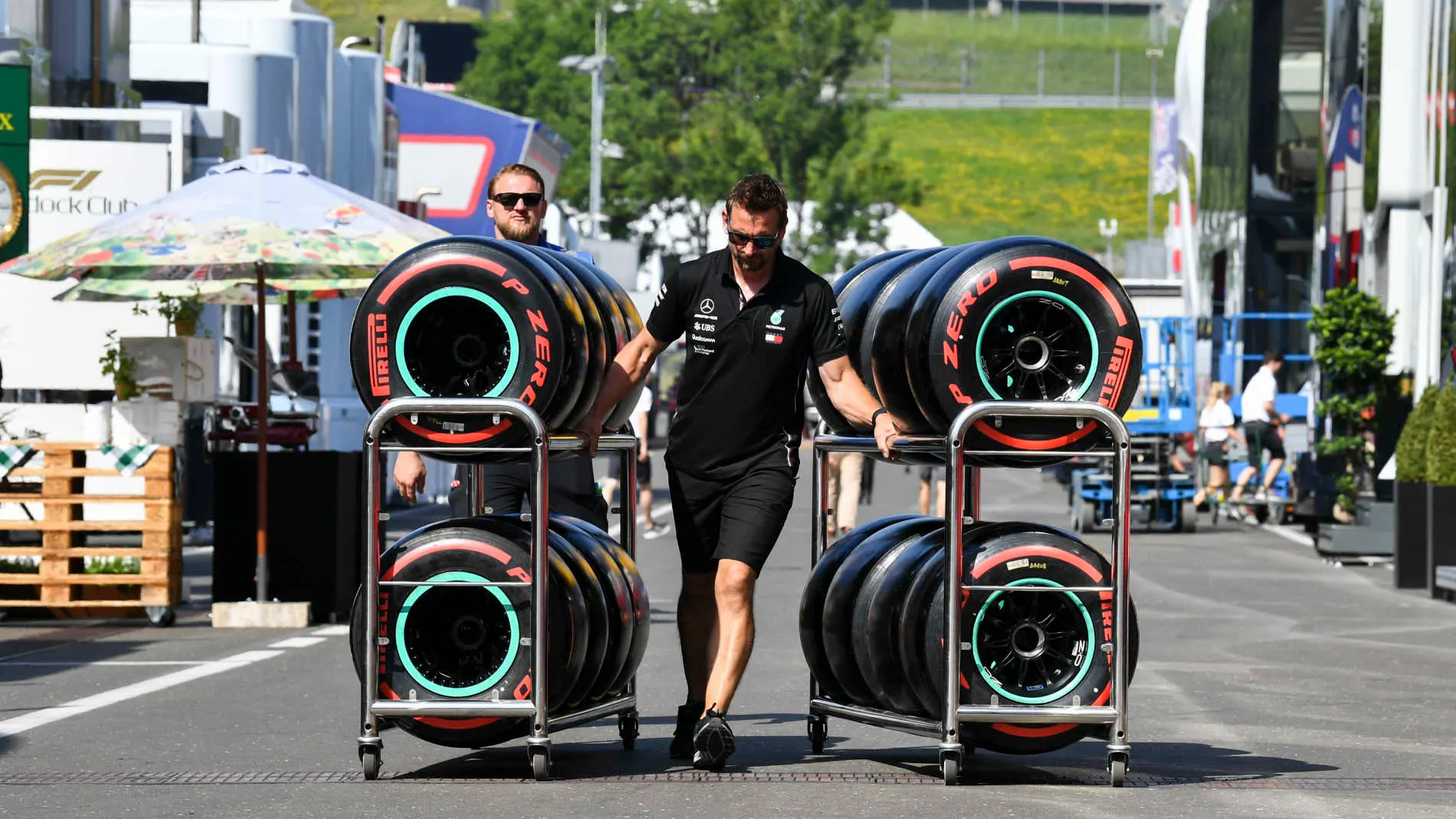 RED BULL RING, AUSTRIA - JUNE 27: Pirelli tyres in the paddock being pushed by a Mercedes Mechanic