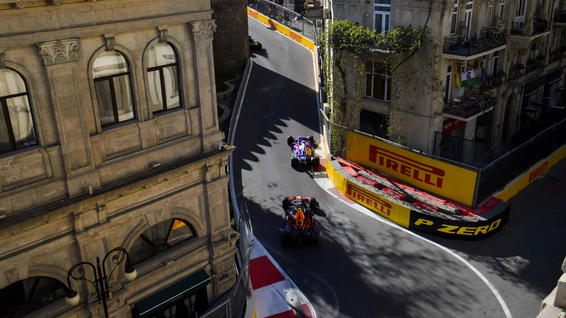 BAKU CITY CIRCUIT, AZERBAIJAN - APRIL 28: Alexander Albon, Toro Rosso STR14, leads Pierre Gasly,