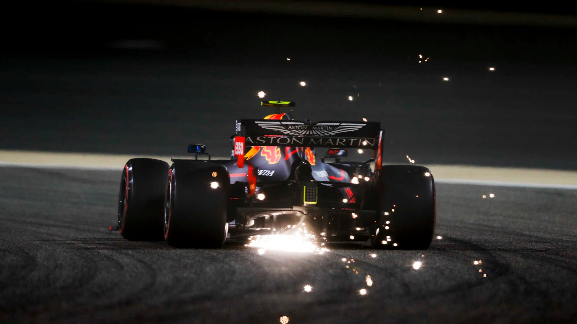 BAHRAIN INTERNATIONAL CIRCUIT, BAHRAIN - MARCH 30: Sparks fly from the rear of Pierre Gasly, Red
