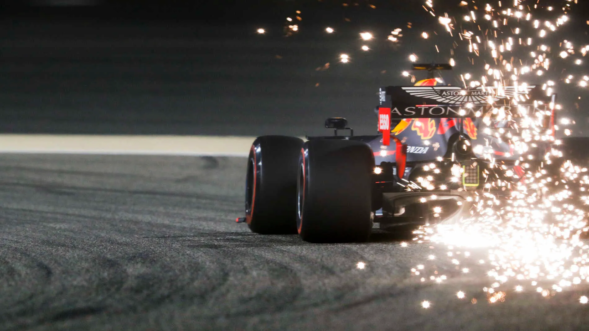 BAHRAIN INTERNATIONAL CIRCUIT, BAHRAIN - MARCH 30: Sparks fly from the rear of Max Verstappen, Red