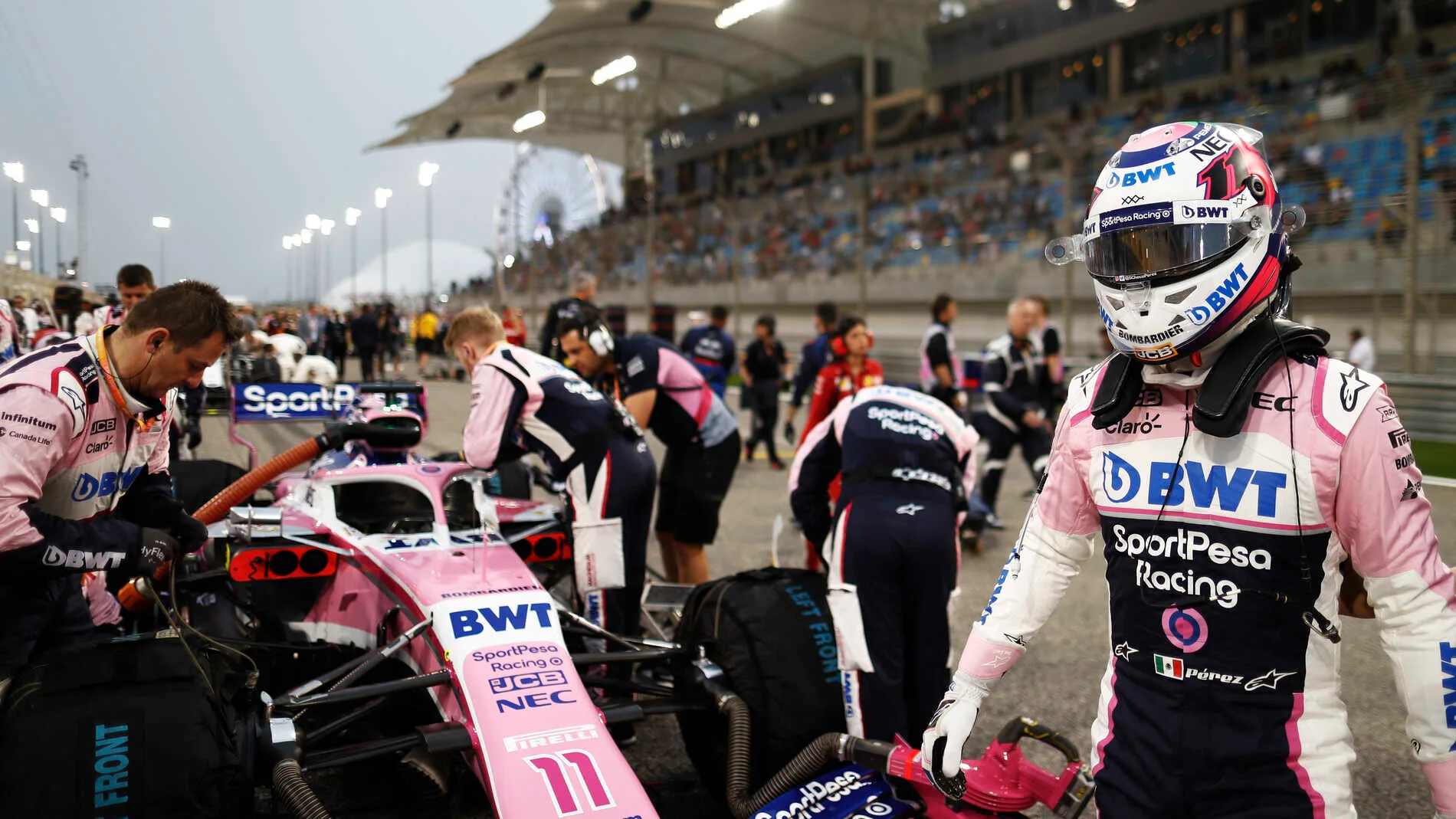 BAHRAIN INTERNATIONAL CIRCUIT, BAHRAIN - MARCH 31: Sergio Perez, Racing Point, on the grid during the Bahrain GP at Bahrain International Circuit on March 31, 2019 in Bahrain International Circuit, Bahrain. (Photo by Glenn Dunbar / LAT Images)