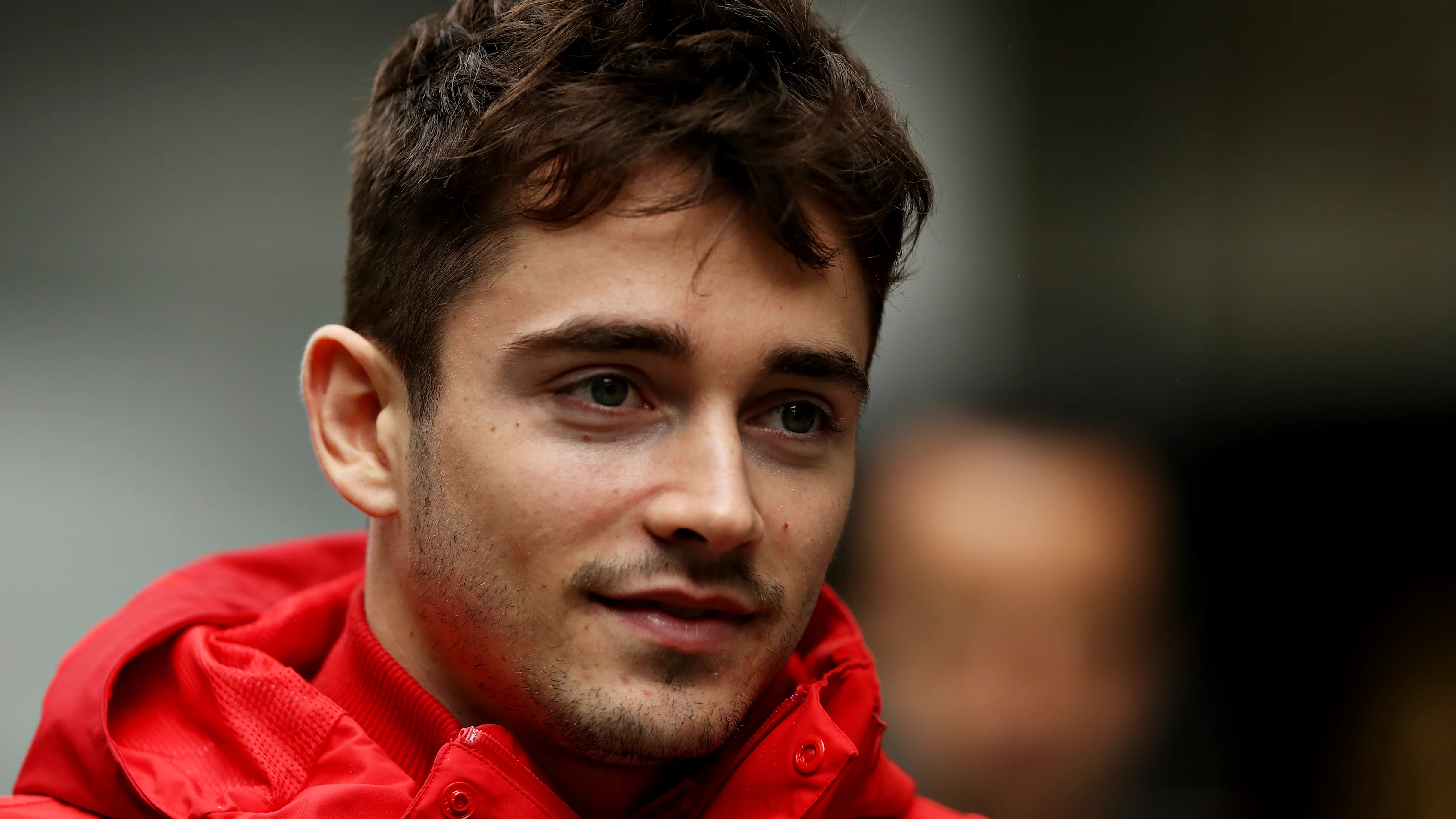 SAO PAULO, BRAZIL - NOVEMBER 16: Charles Leclerc of Monaco and Ferrari walks in the Paddock before