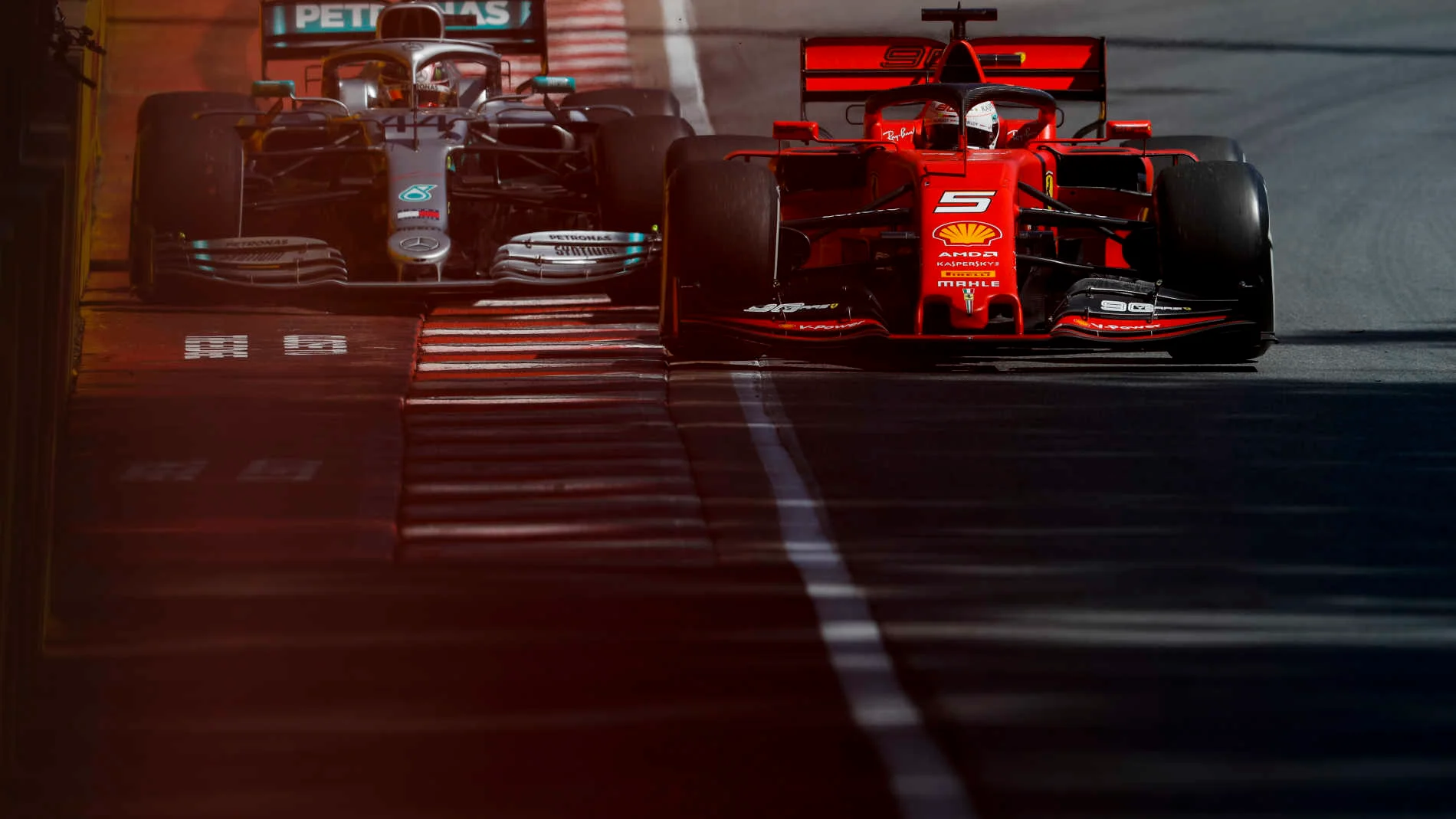 CIRCUIT GILLES-VILLENEUVE, CANADA - JUNE 09: Sebastian Vettel, Ferrari SF90, leads Lewis Hamilton,