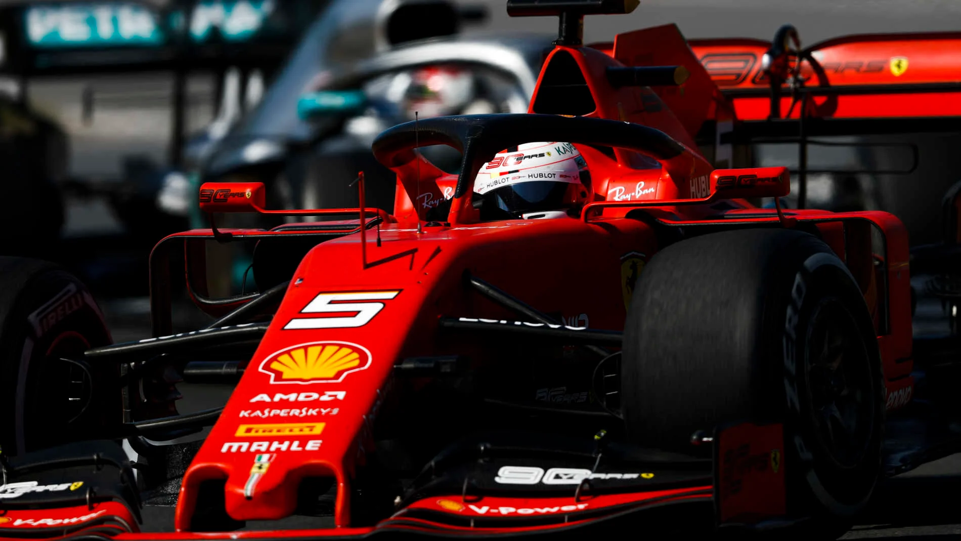 CIRCUIT GILLES-VILLENEUVE, CANADA - JUNE 09: Sebastian Vettel, Ferrari SF90, leads Lewis Hamilton,