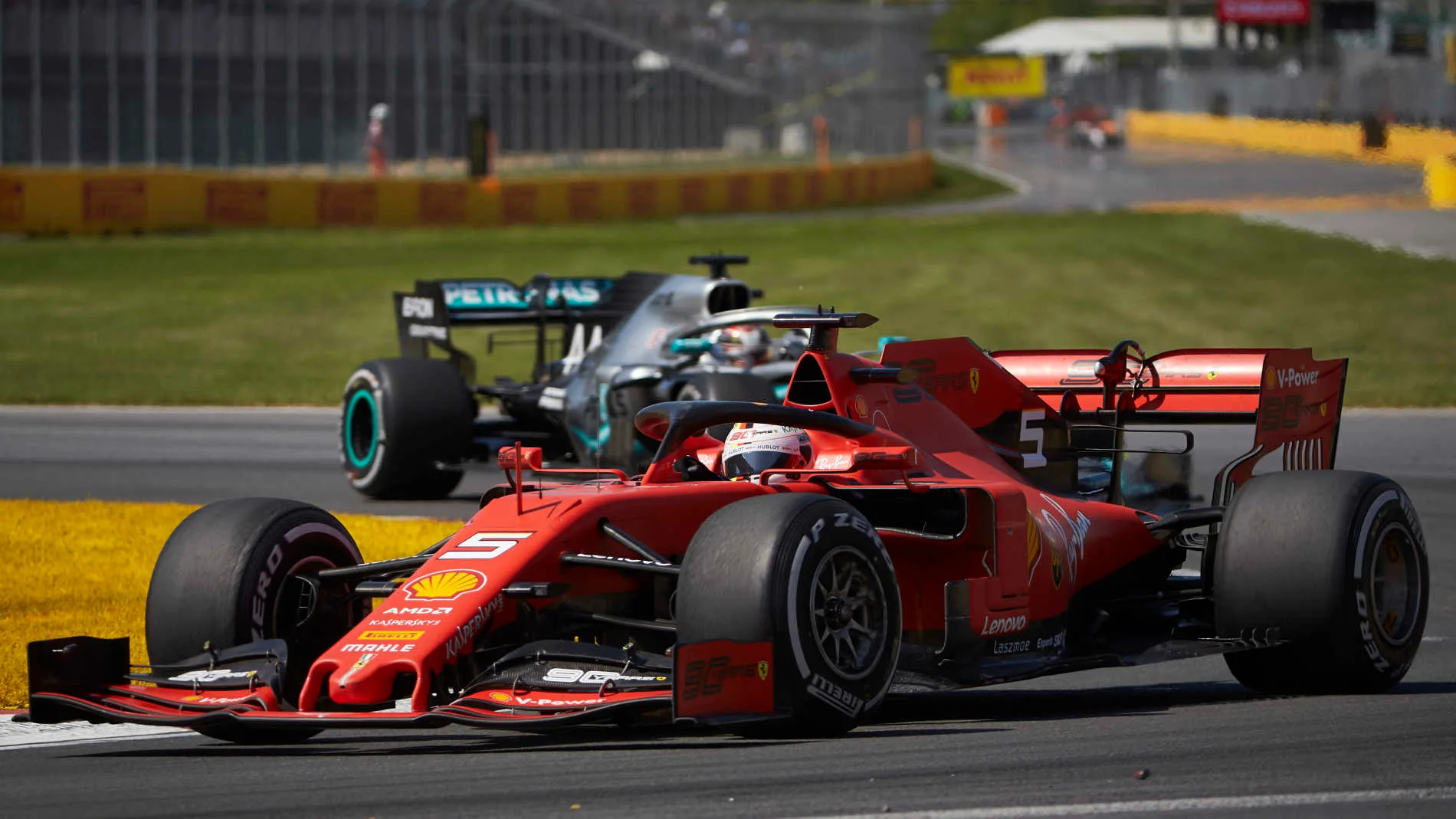 CIRCUIT GILLES-VILLENEUVE, CANADA - JUNE 09: Sebastian Vettel, Ferrari SF90, leads Lewis Hamilton,