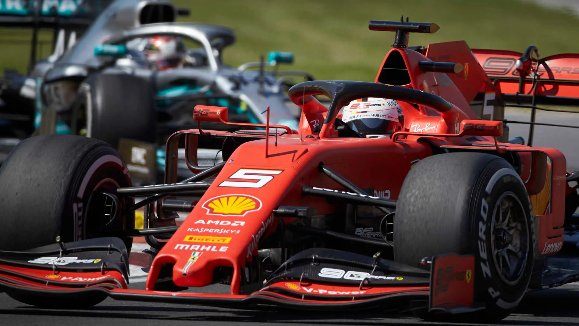 CIRCUIT GILLES-VILLENEUVE, CANADA - JUNE 09: Sebastian Vettel, Ferrari SF90, leads Lewis Hamilton,
