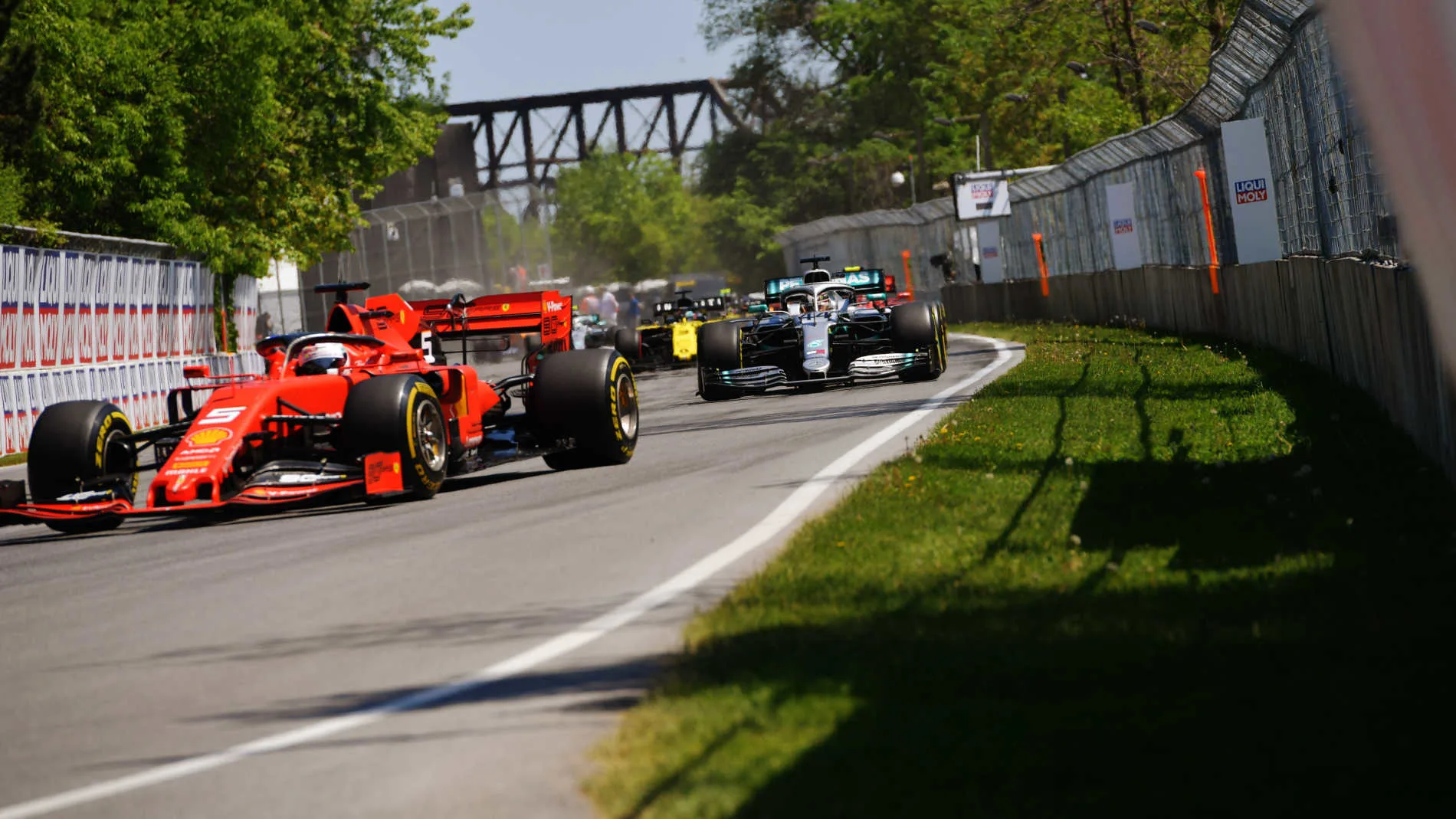 CIRCUIT GILLES-VILLENEUVE, CANADA - JUNE 09: Sebastian Vettel, Ferrari SF90, leads Lewis Hamilton,