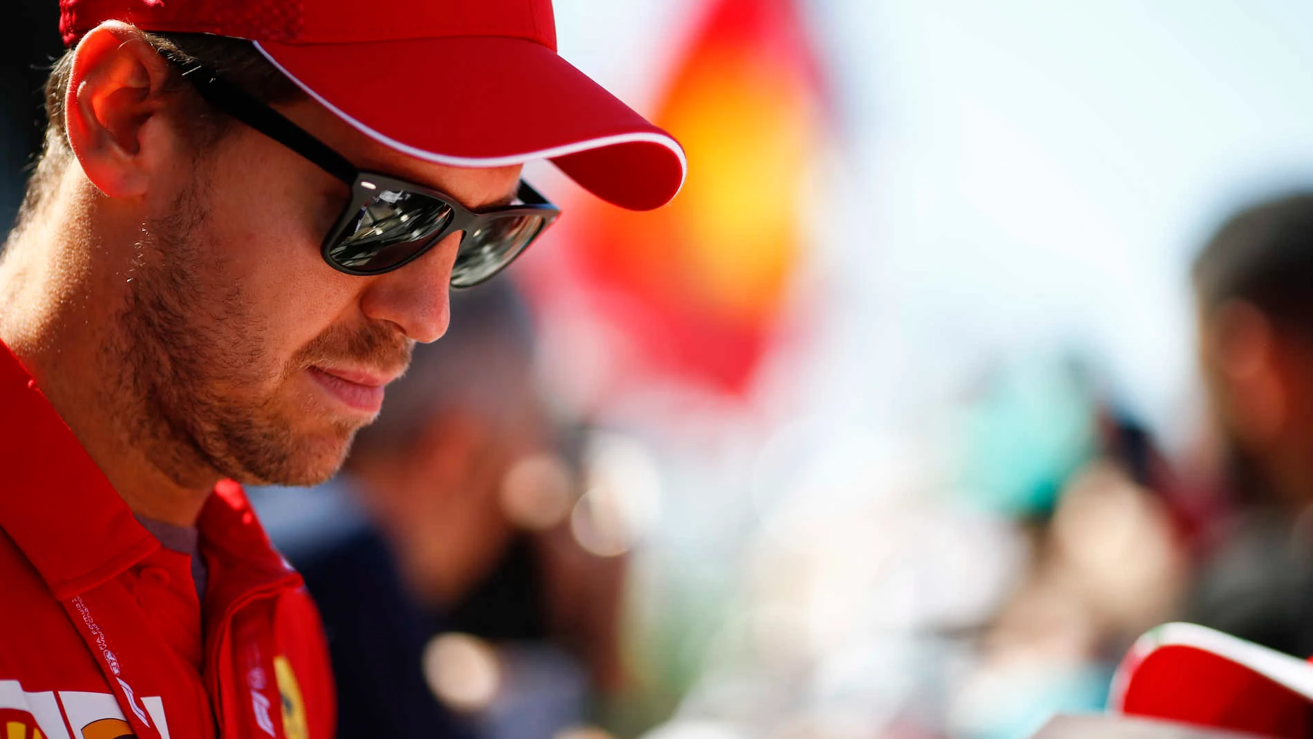 CIRCUIT GILLES-VILLENEUVE, CANADA - JUNE 06: Sebastian Vettel, Ferrari signs a autograph for a fan