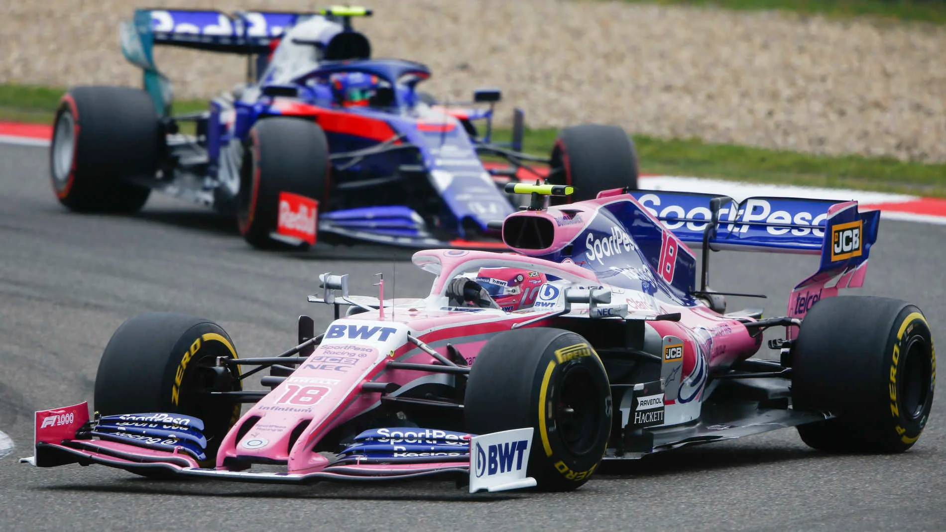 SHANGHAI INTERNATIONAL CIRCUIT, CHINA - APRIL 14: Lance Stroll, Racing Point RP19, leads Alexander Albon, Toro Rosso STR14 during the Chinese GP at Shanghai International Circuit on April 14, 2019 in Shanghai International Circuit, China. (Photo by Andy Hone / LAT Images)