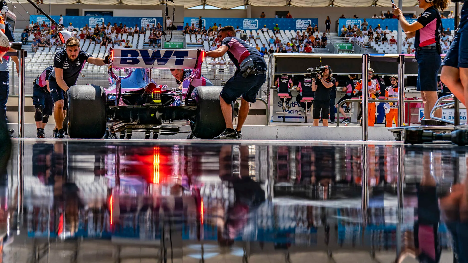 CIRCUIT PAUL RICARD, FRANCE - JUNE 21: Sergio Perez, Racing Point RP19, is returned to the garage