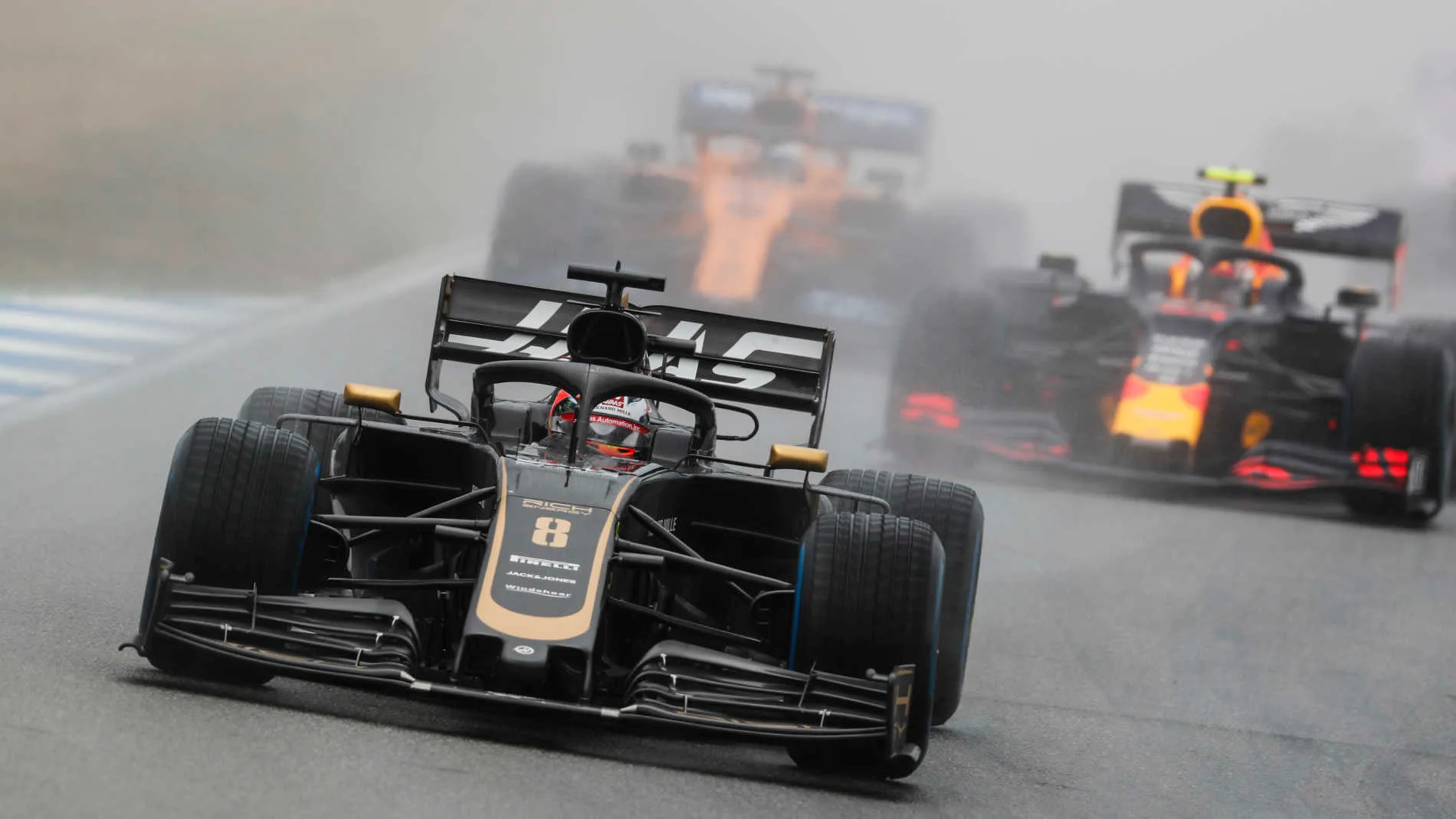 HOCKENHEIMRING, GERMANY - JULY 28: Romain Grosjean, Haas VF-19, leads Pierre Gasly, Red Bull Racing