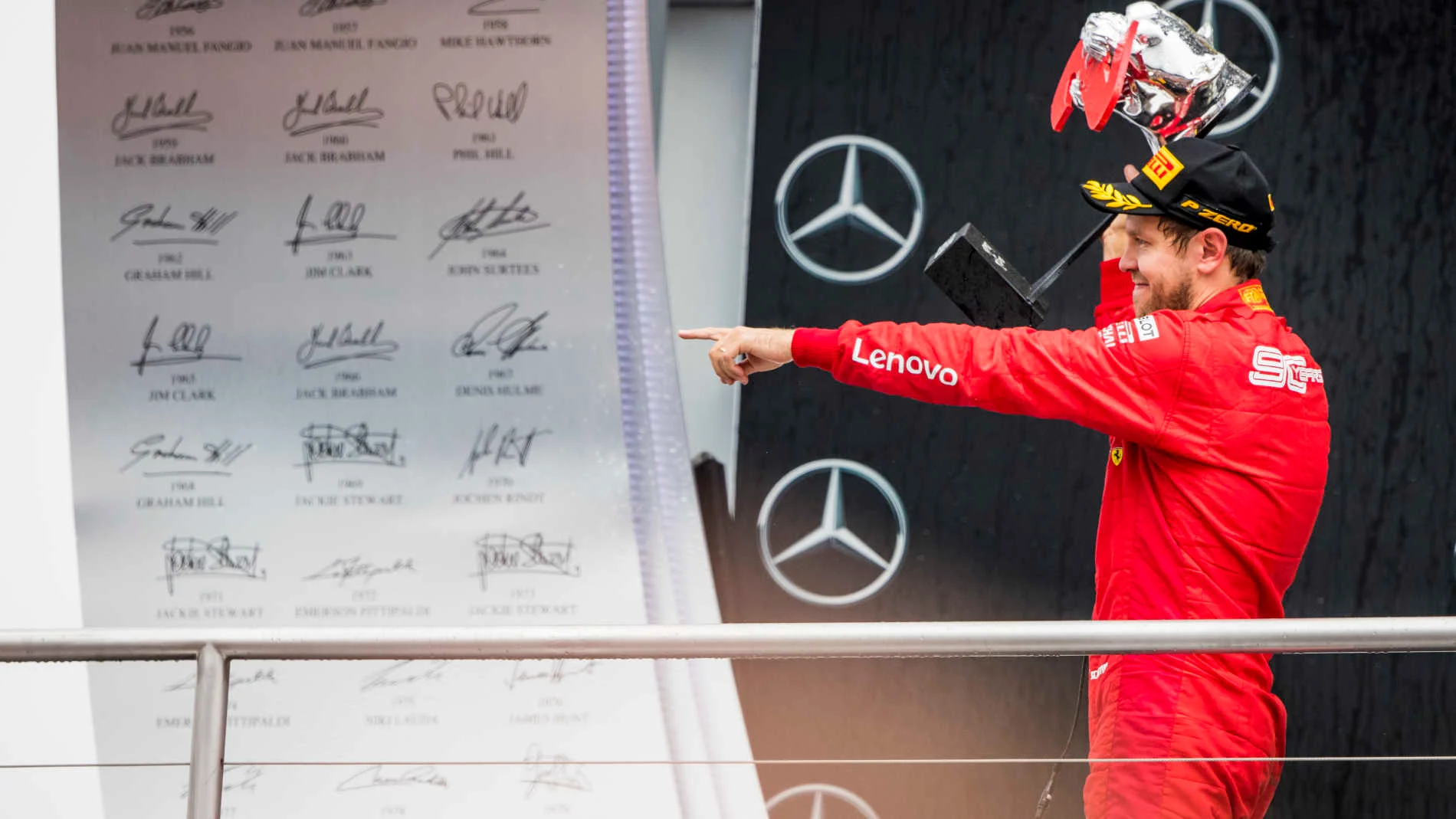 HOCKENHEIMRING, GERMANY - JULY 28: Sebastian Vettel, Ferrari celebrate on the podium with the trophy during the German GP at Hockenheimring on July 28, 2019 in Hockenheimring, Germany. (Photo by Sam Bloxham / LAT Images)