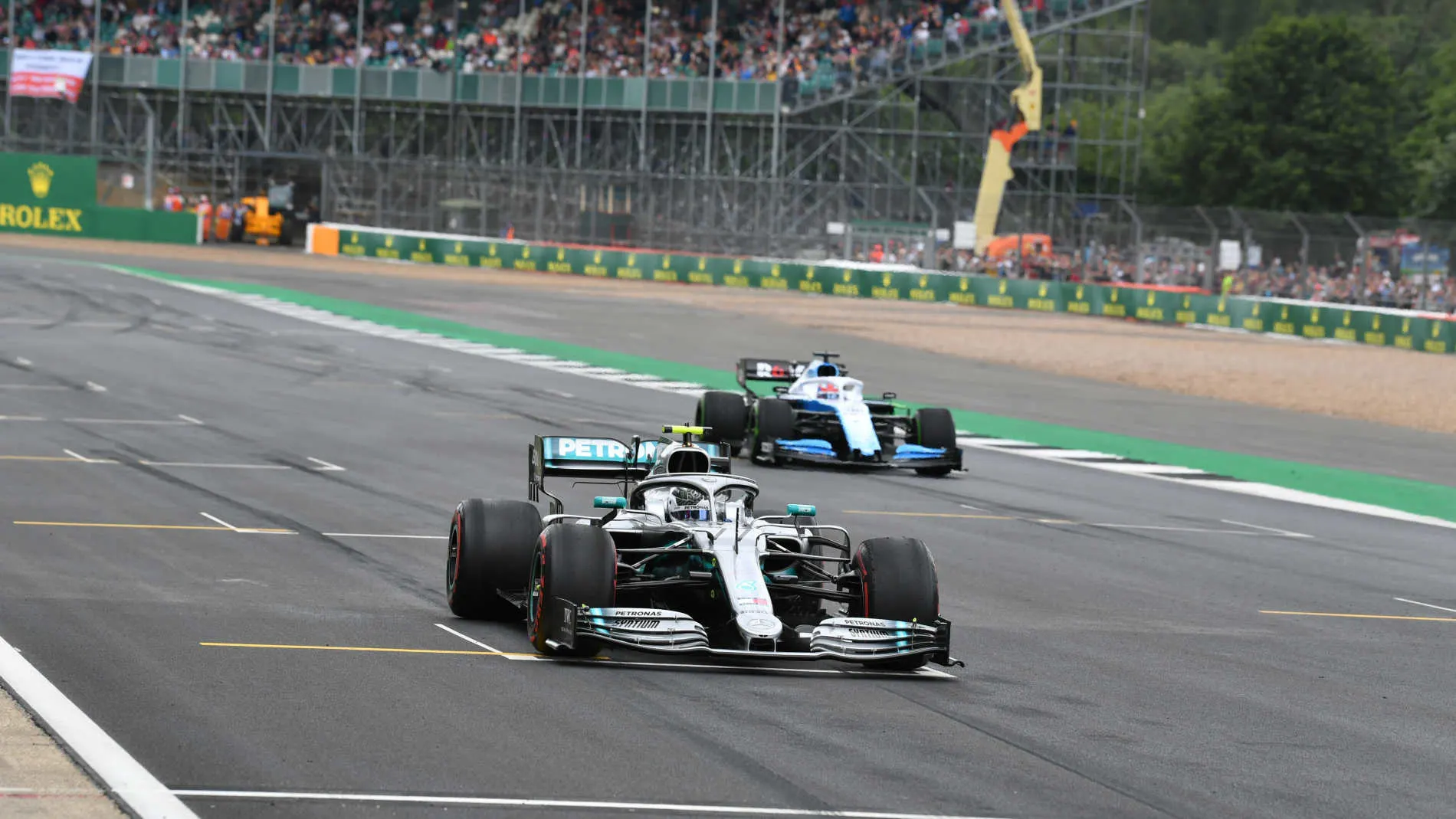 SILVERSTONE, UNITED KINGDOM - JULY 12: Valtteri Bottas, Mercedes AMG W10, and George Russell,