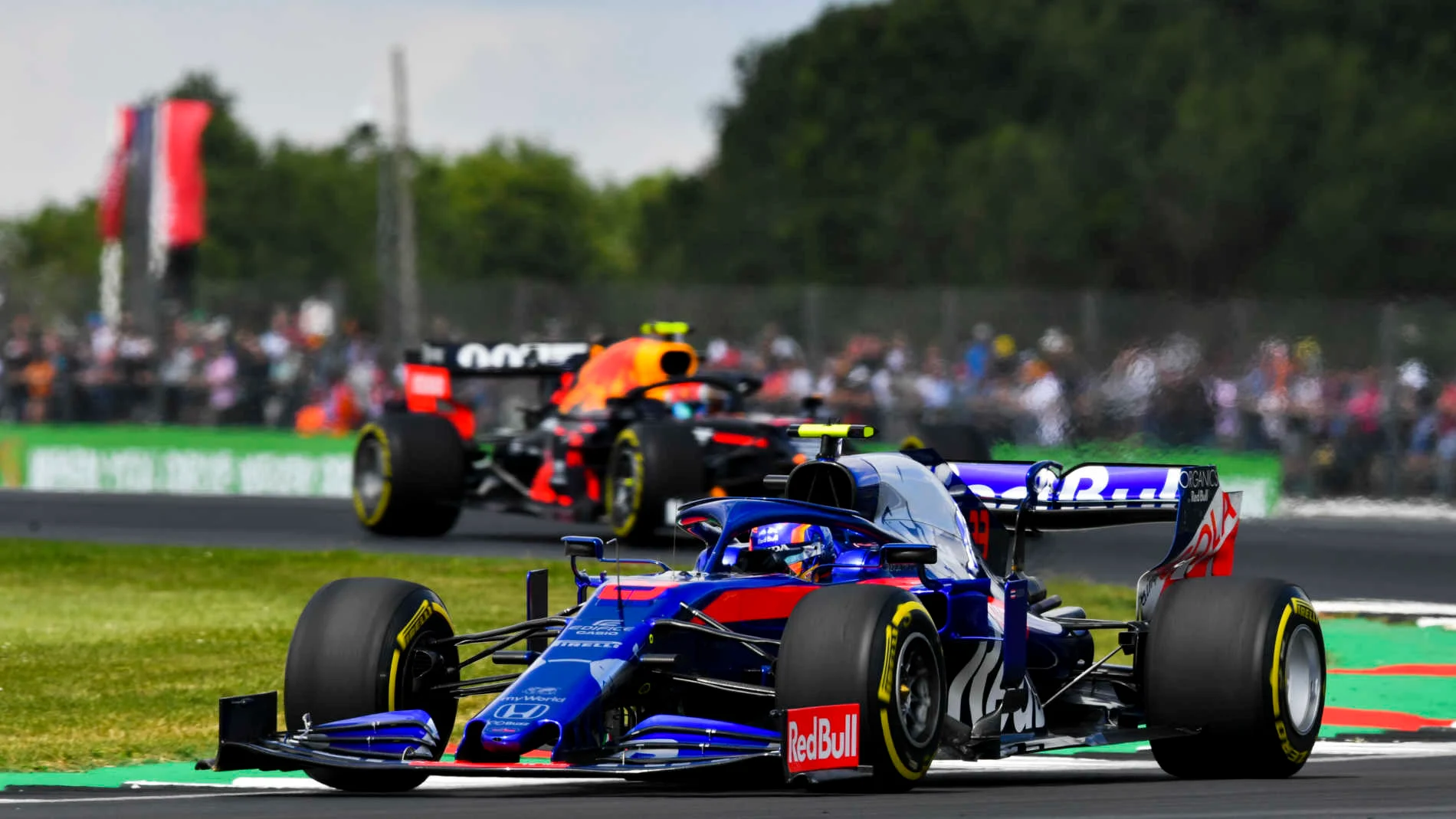 SILVERSTONE, UNITED KINGDOM - JULY 12: Alexander Albon, Toro Rosso STR14, leads Pierre Gasly, Red