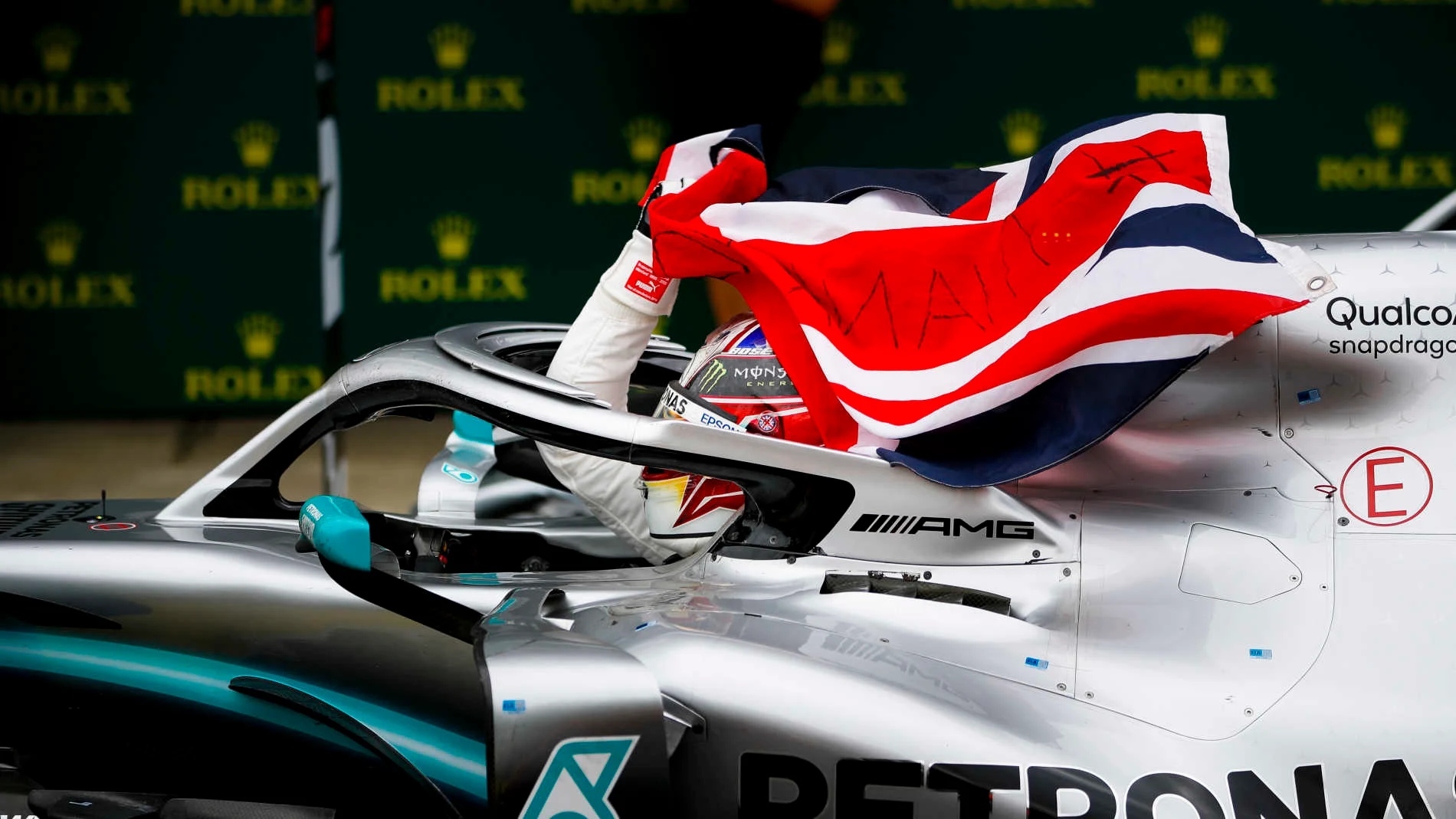 SILVERSTONE, UNITED KINGDOM - JULY 14: Race winner Lewis Hamilton, Mercedes AMG F1 W10 with a flag